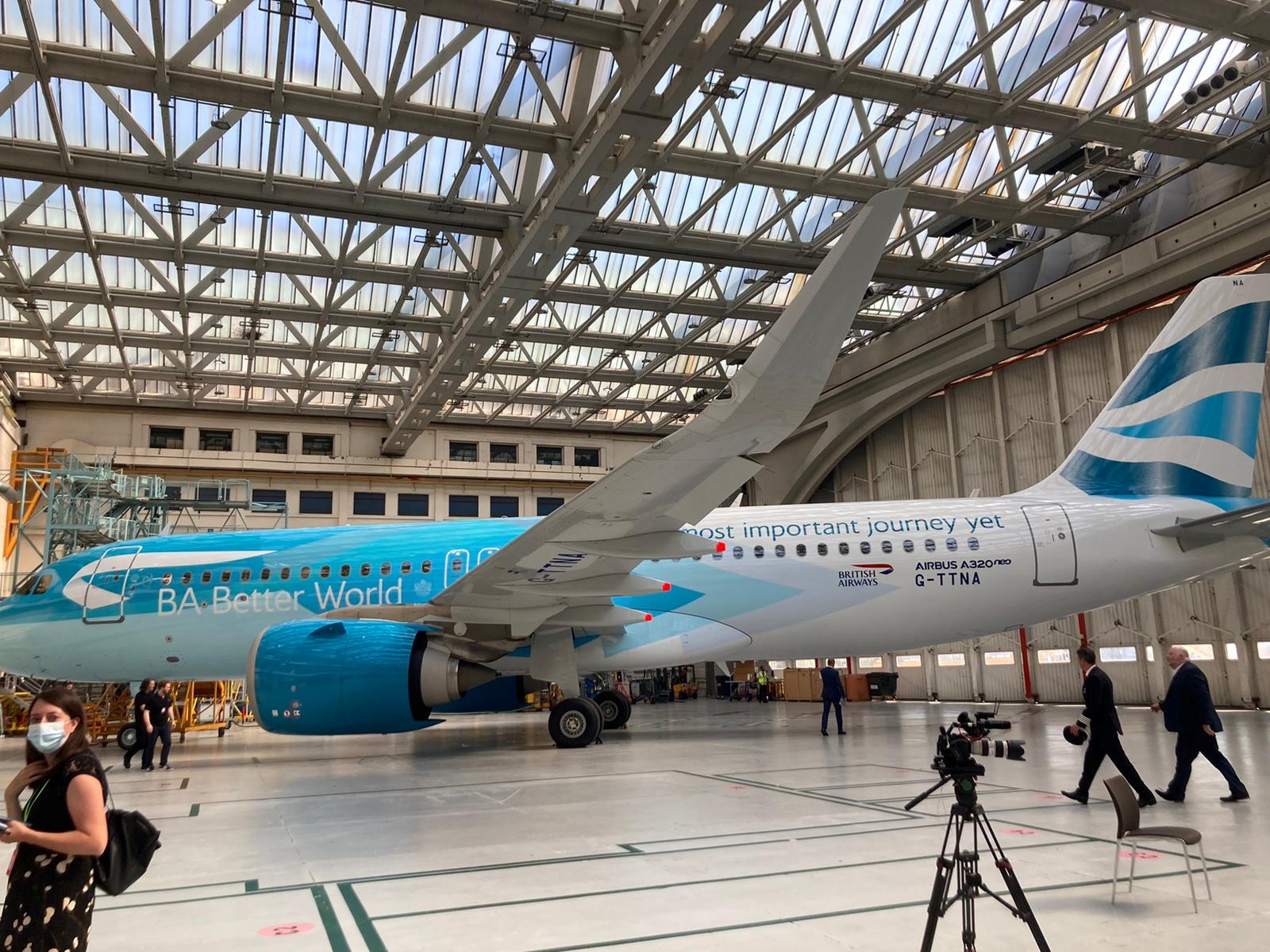 A British Airways A320neo painted in new livery stands in a hangar at Heathrow Airport to launch the airline's BA Better World sustainability programme, in London