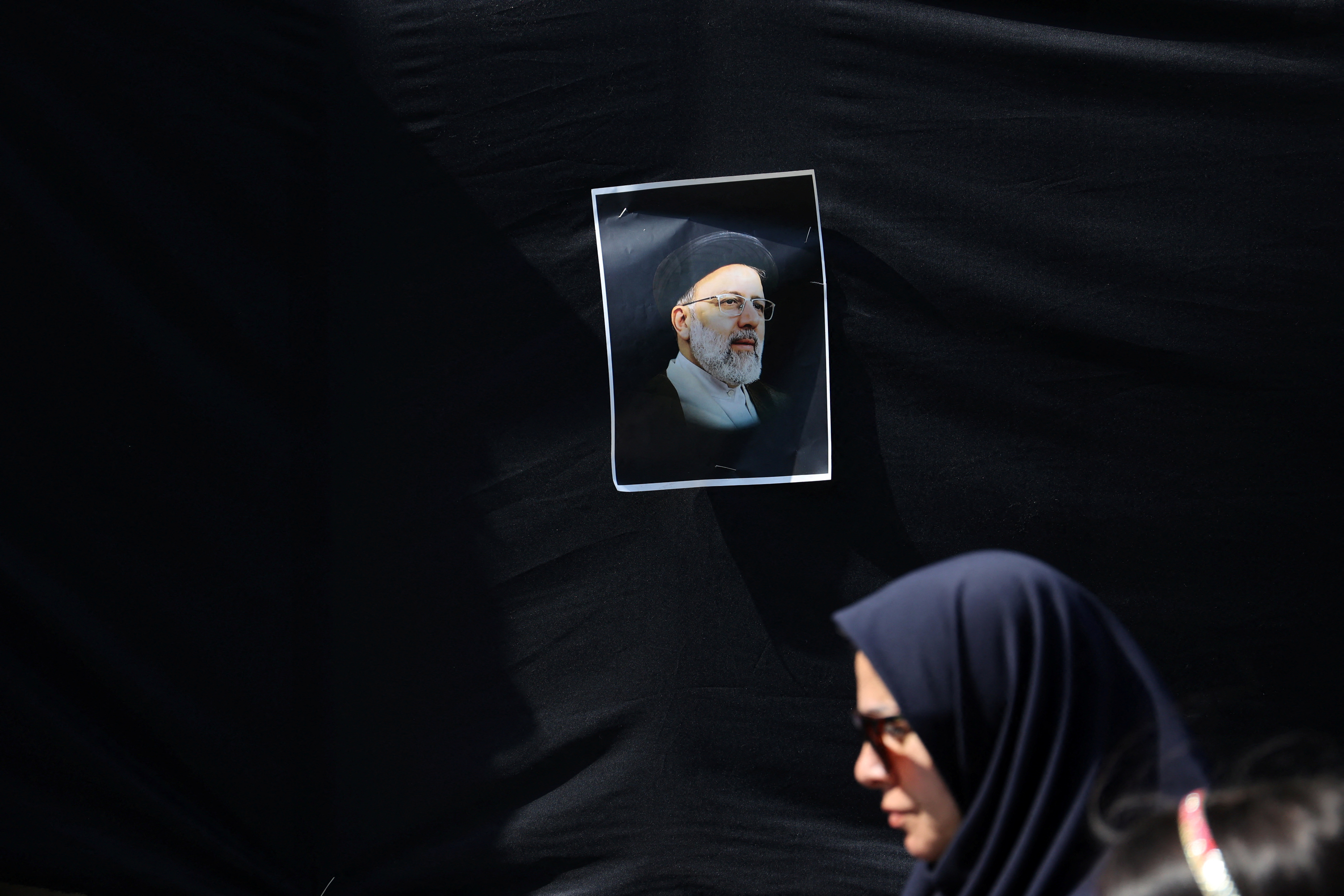 A banner with a picture of the late Iran's President Ebrahim Raisi is seen on a street in Tehran