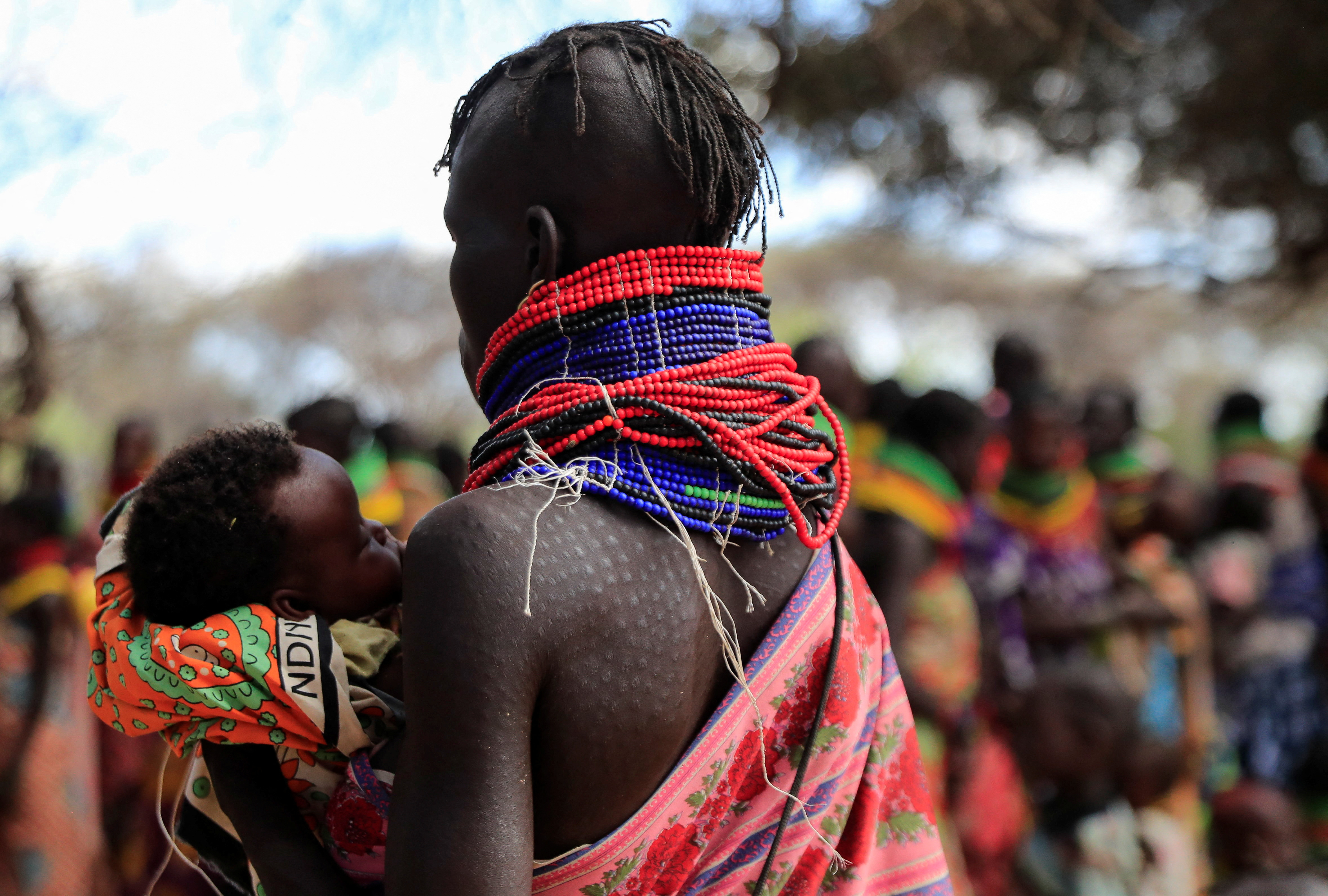 A woman and her child from the Turkana pastoralist community affected by the worsening drought due to failed rain seasons, arrive at an integrated outreach medical clinic in Kakimat village in Turkana