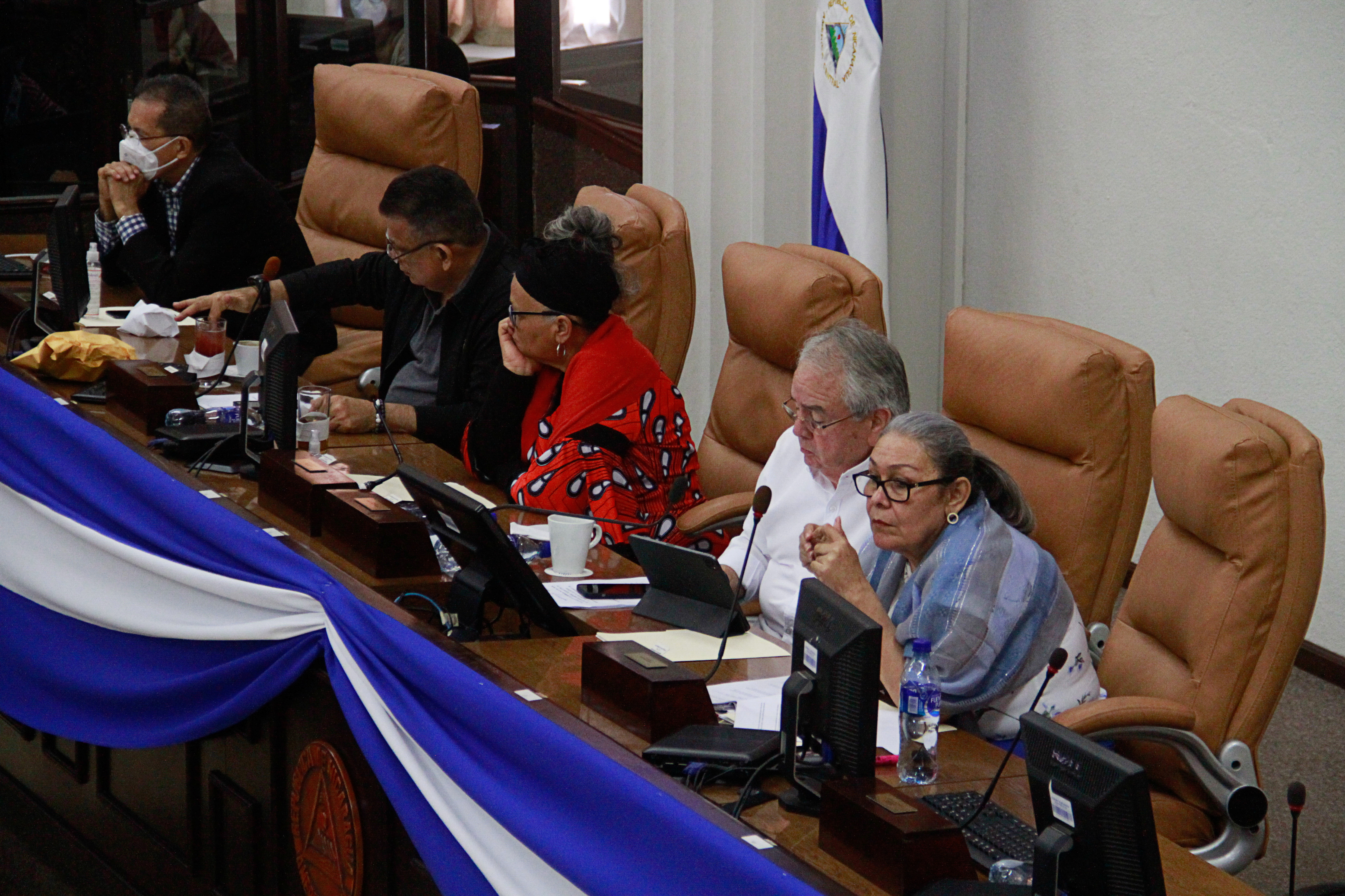 Nicaraguan lawmakers Maritza Espinales, Gustavo Porras and Gloria Dixon attend a session where they approved a law that calls on President Daniel Ortega to denounce the democratic charter of the Organization of the American States (OAS), a move that one lawmaker said would be a prelude to Nicaragua leaving the body, in Managua, Nicaragua November 16, 2021. REUTERS/Stringer 