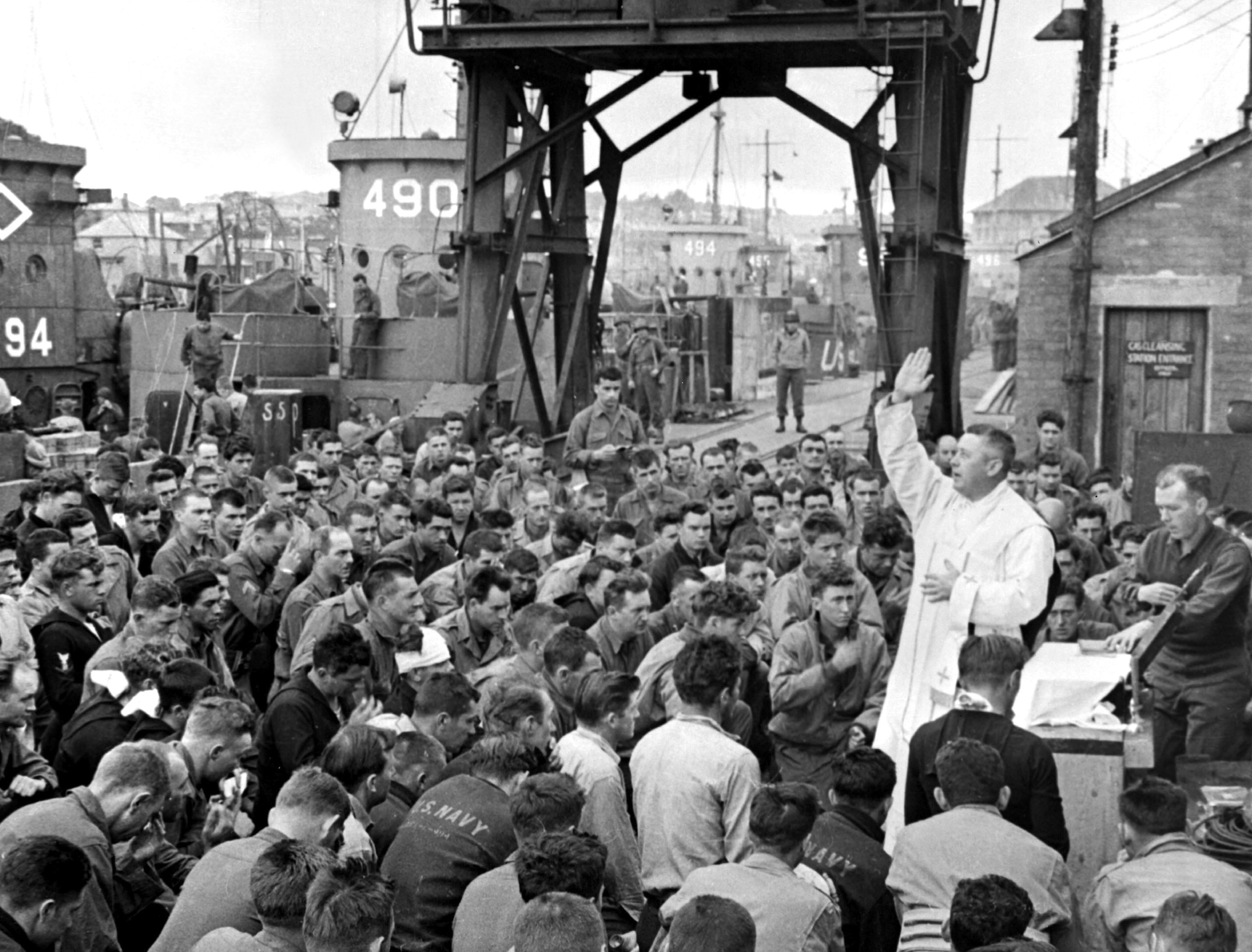 '- HANDOUT FILE PHOTO TAKEN 06JUN1944 - Father (Major) Edward J. Waters, Catholic Chaplain from Osweg..