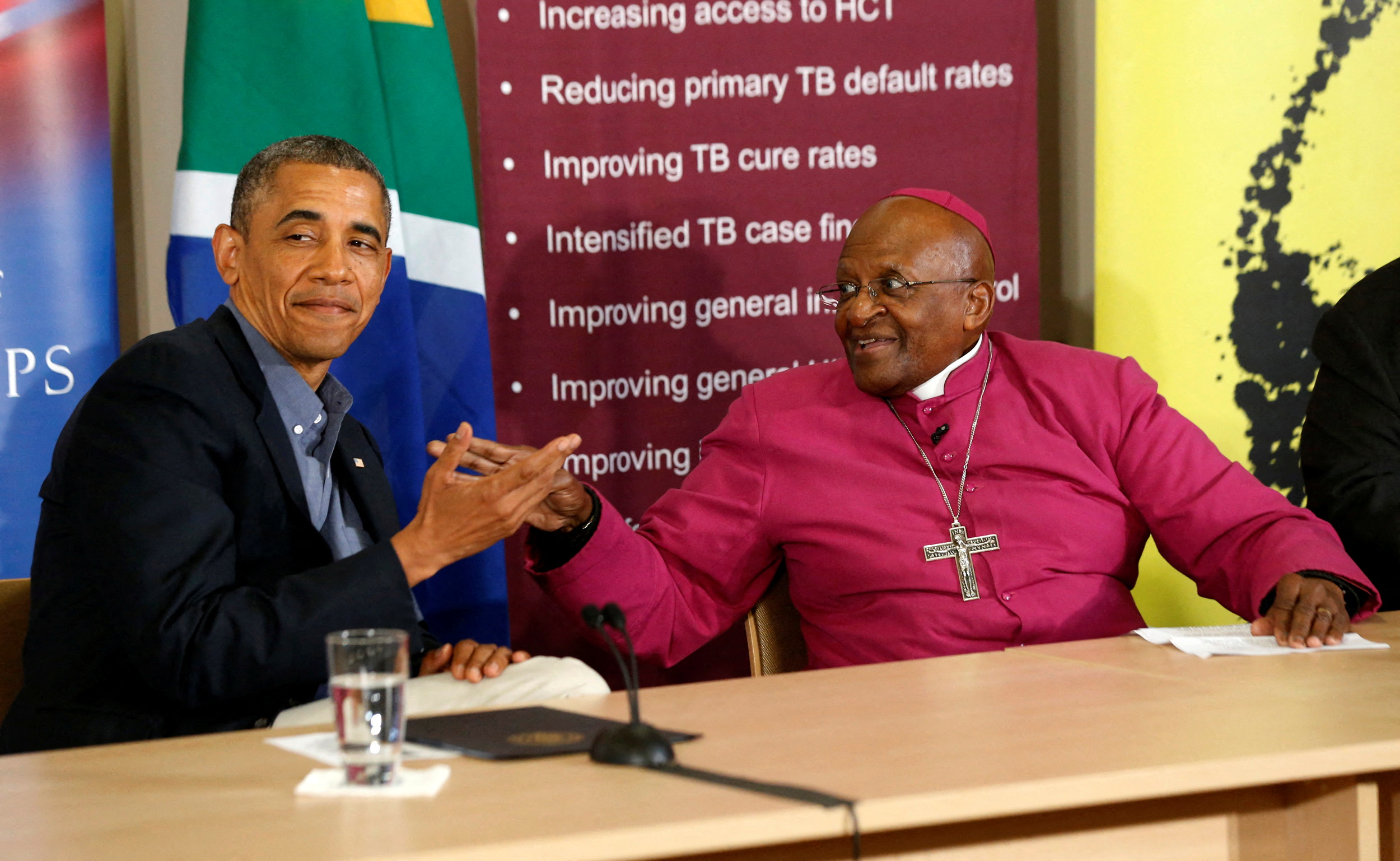 U.S. President Barack Obama is pictured alongside Desmond Tutu as he visits his HIV Foundation Youth Centre and takes part in a health event with youth in Cape Town
