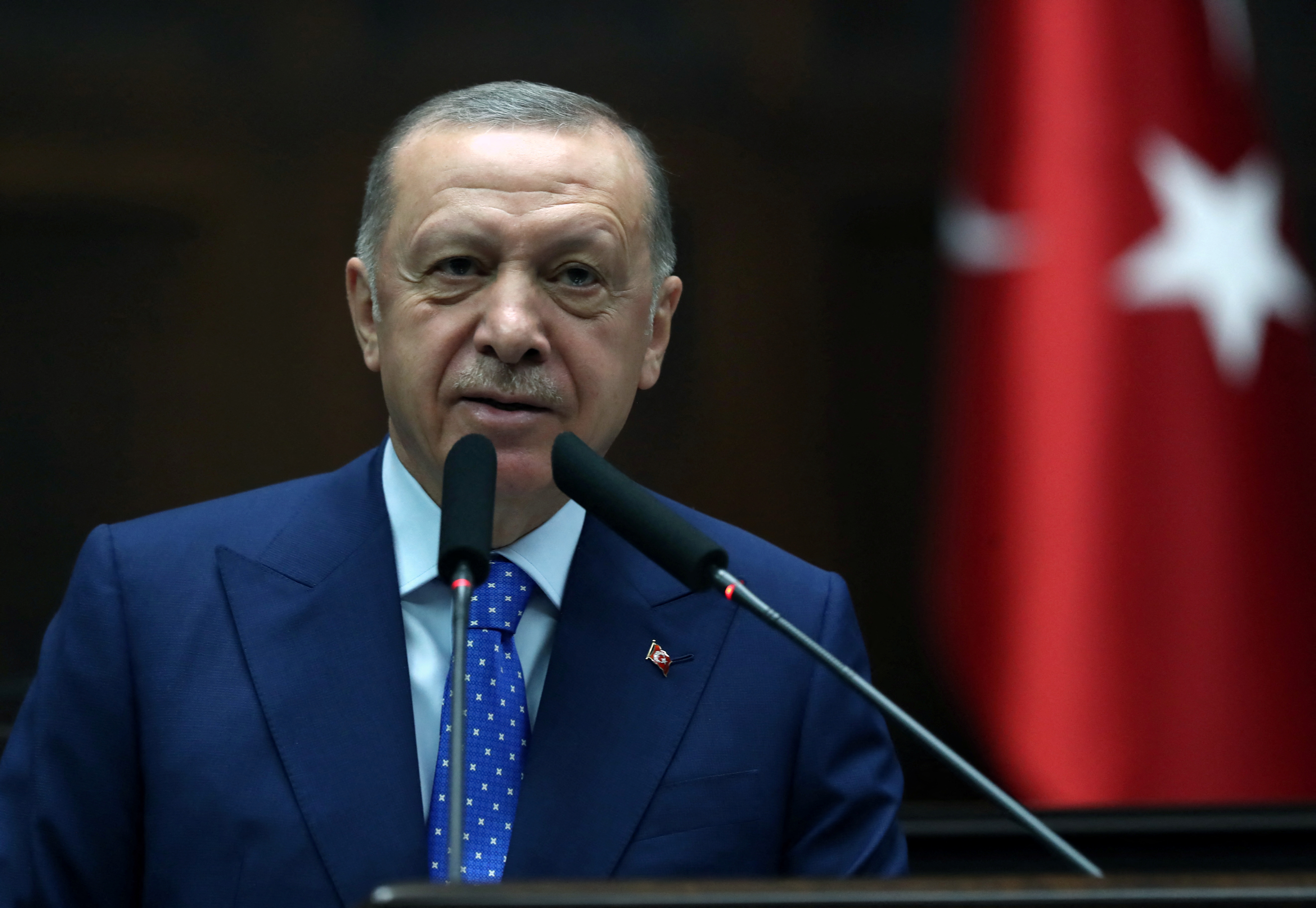 Turkish President Erdogan addresses members of AKP during a meeting at the parliament in Ankara