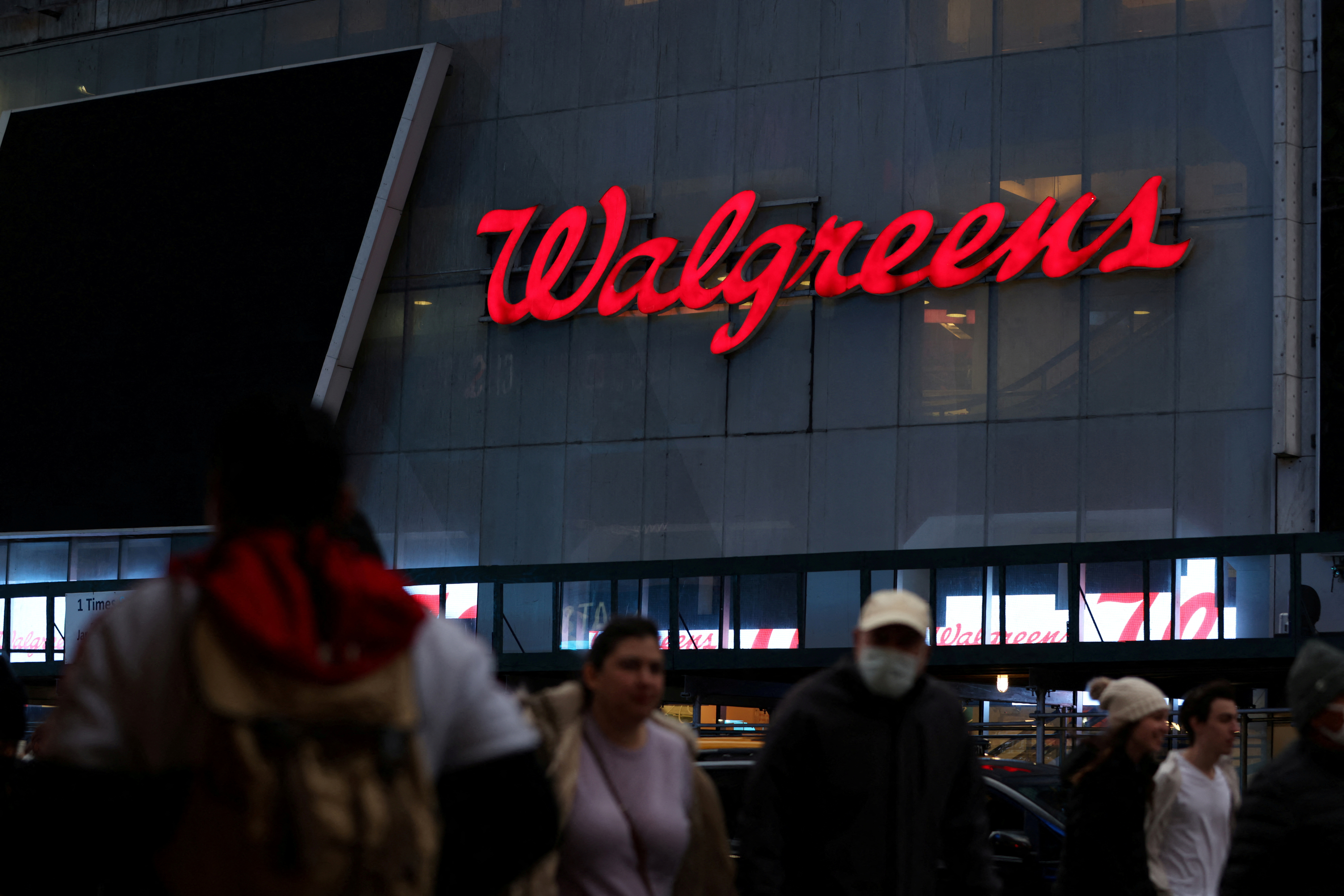 People walk by a Walgreens, owned by the Walgreens Boots Alliance, Inc., in Manhattan, New York City
