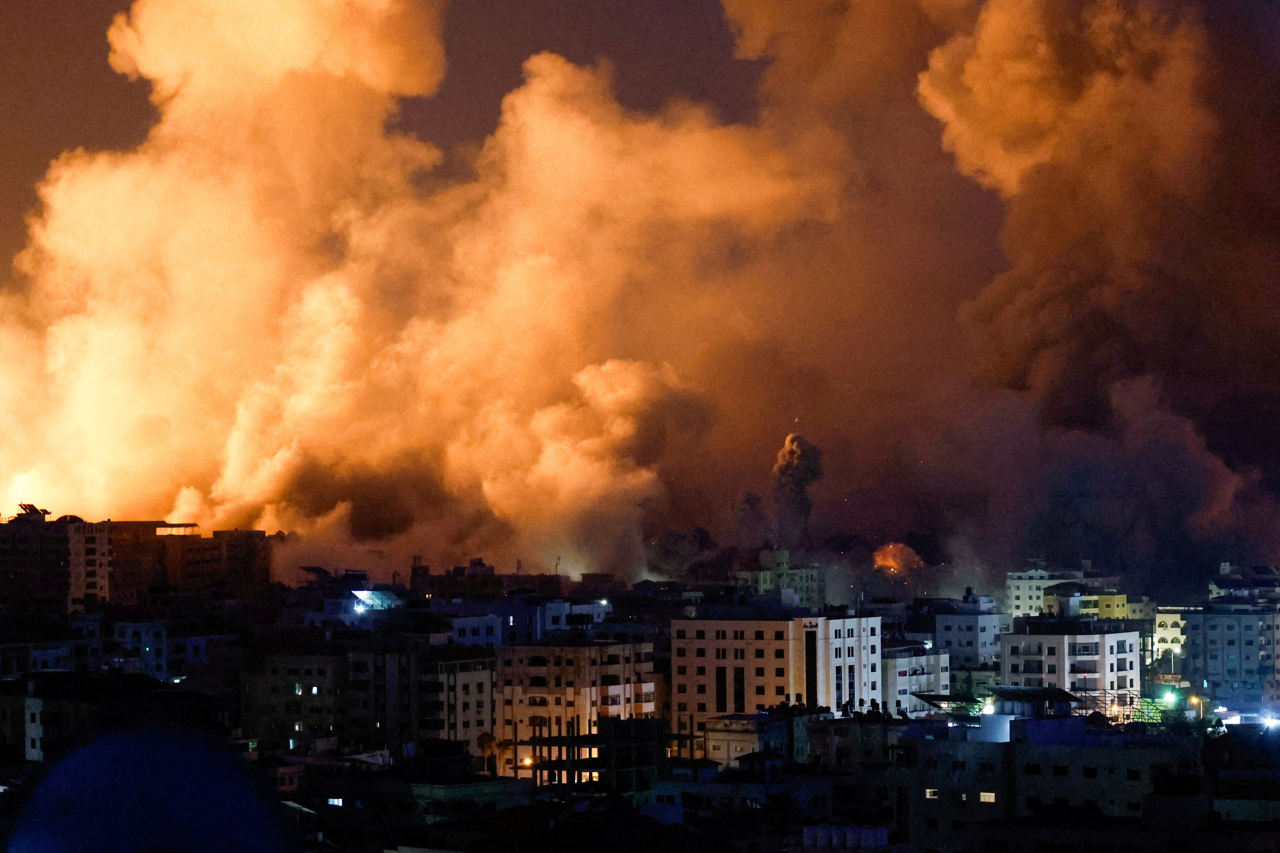 Flames and smoke billow during Israeli strikes in Gaza
