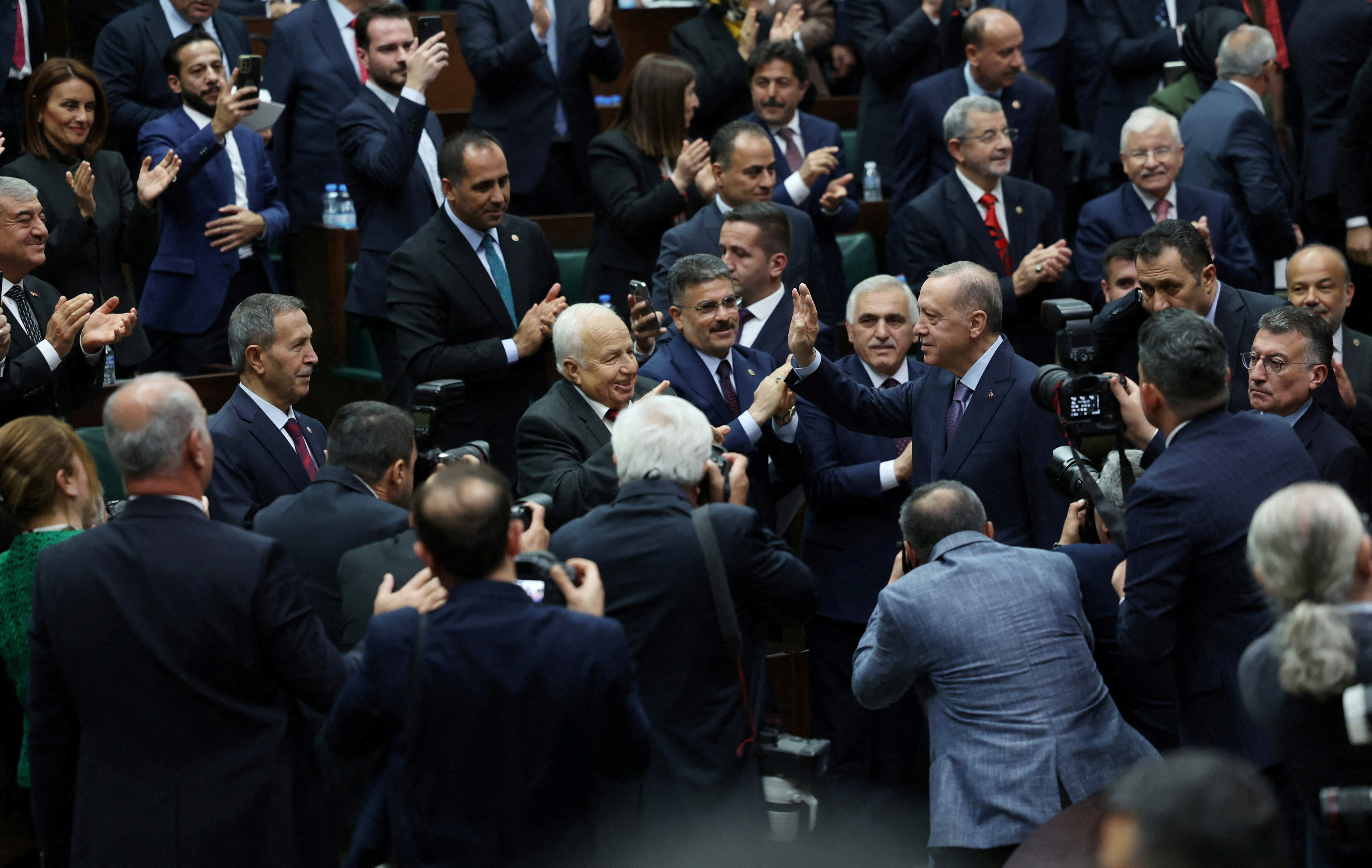 Turkish President Tayyip Erdogan greets lawmakers of his AK Party t in the Turkish parliament in Ankara