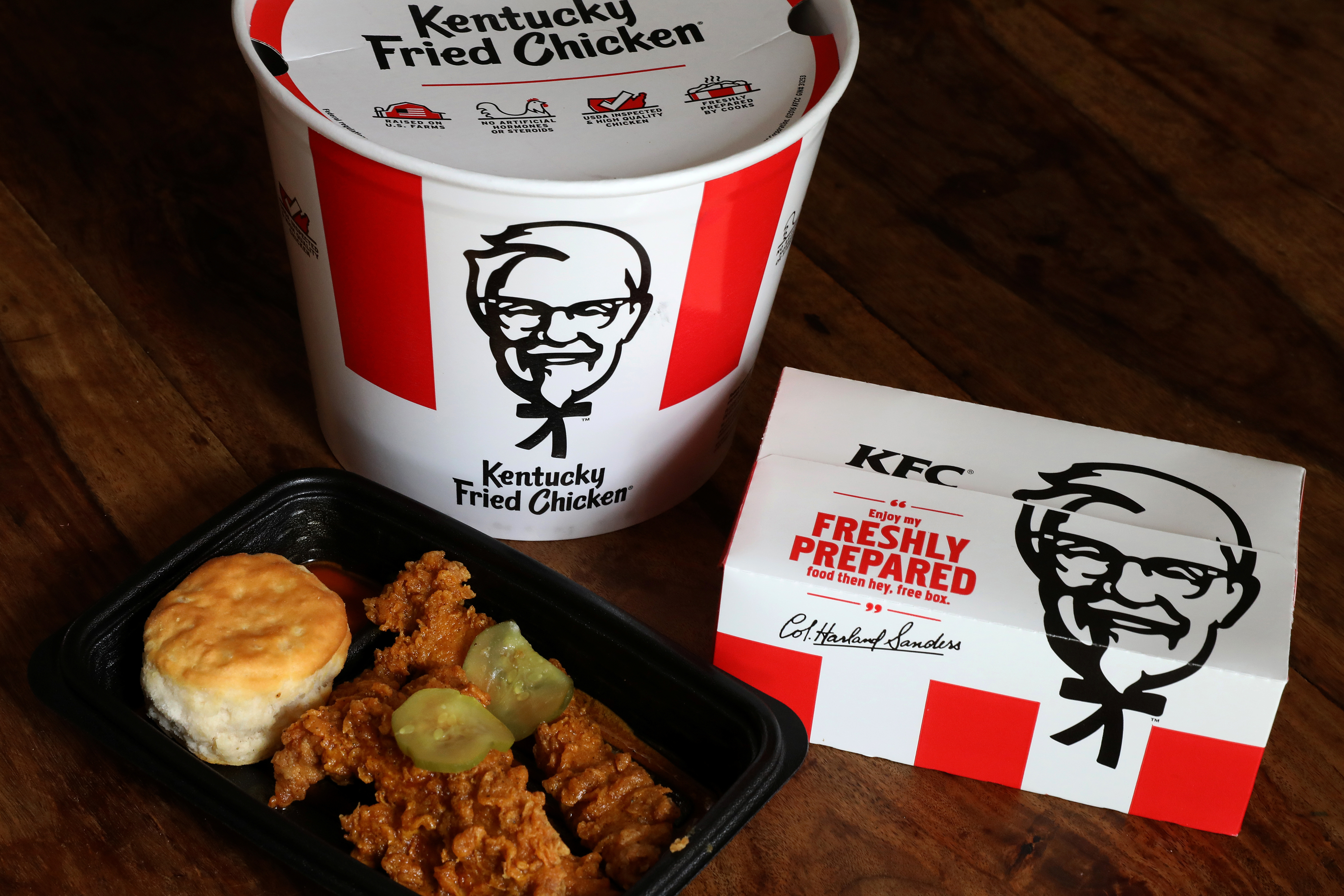 Kentucky Fried Chicken (KFC) tenders, a bucket and box of chicken are seen in this picture illustration