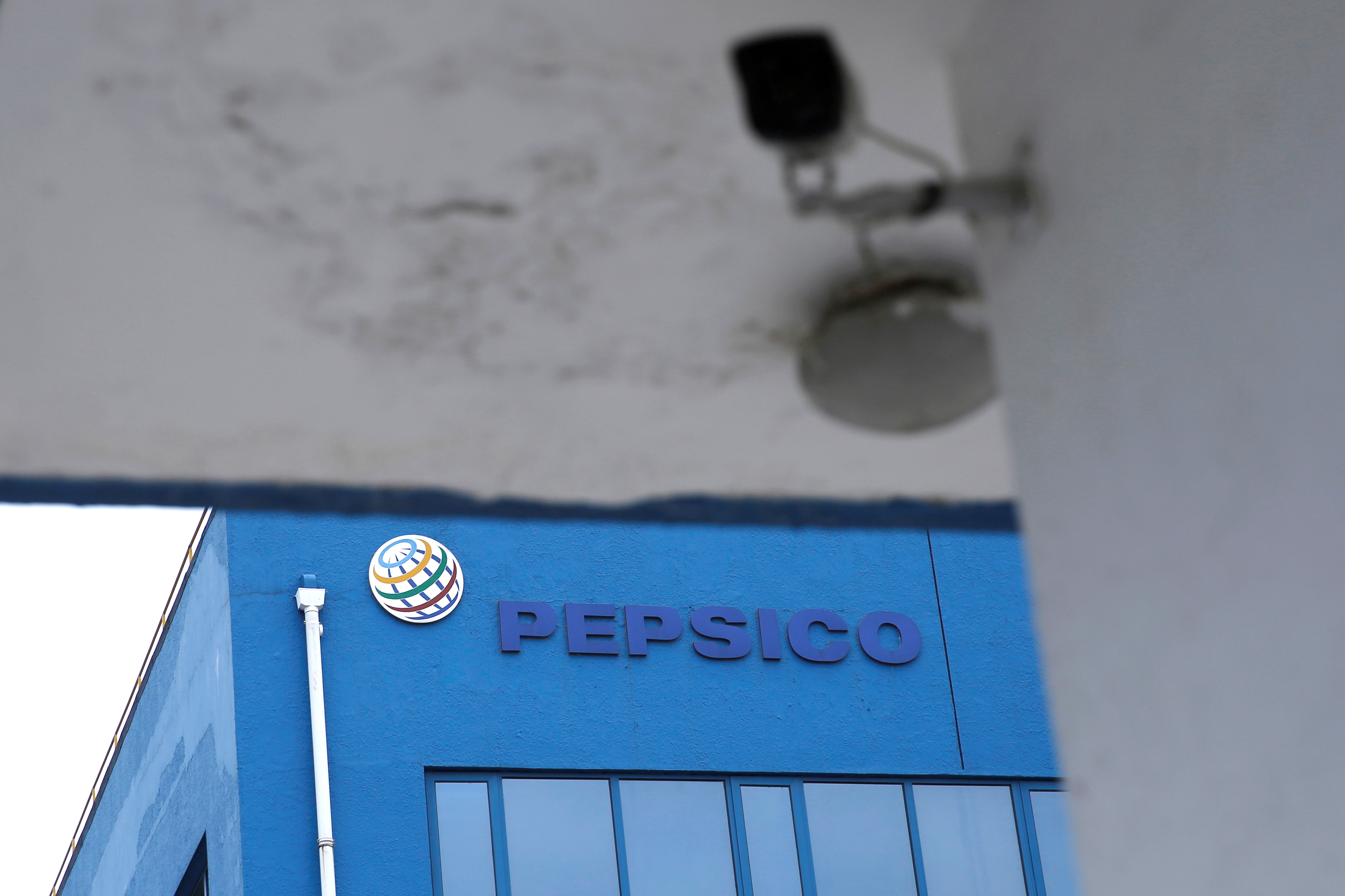 Pepsico sign is seen at its food-processing plant near a surveillance camera in Beijing's Daxing district, following a new outbreak of the coronavirus disease (COVID-19)