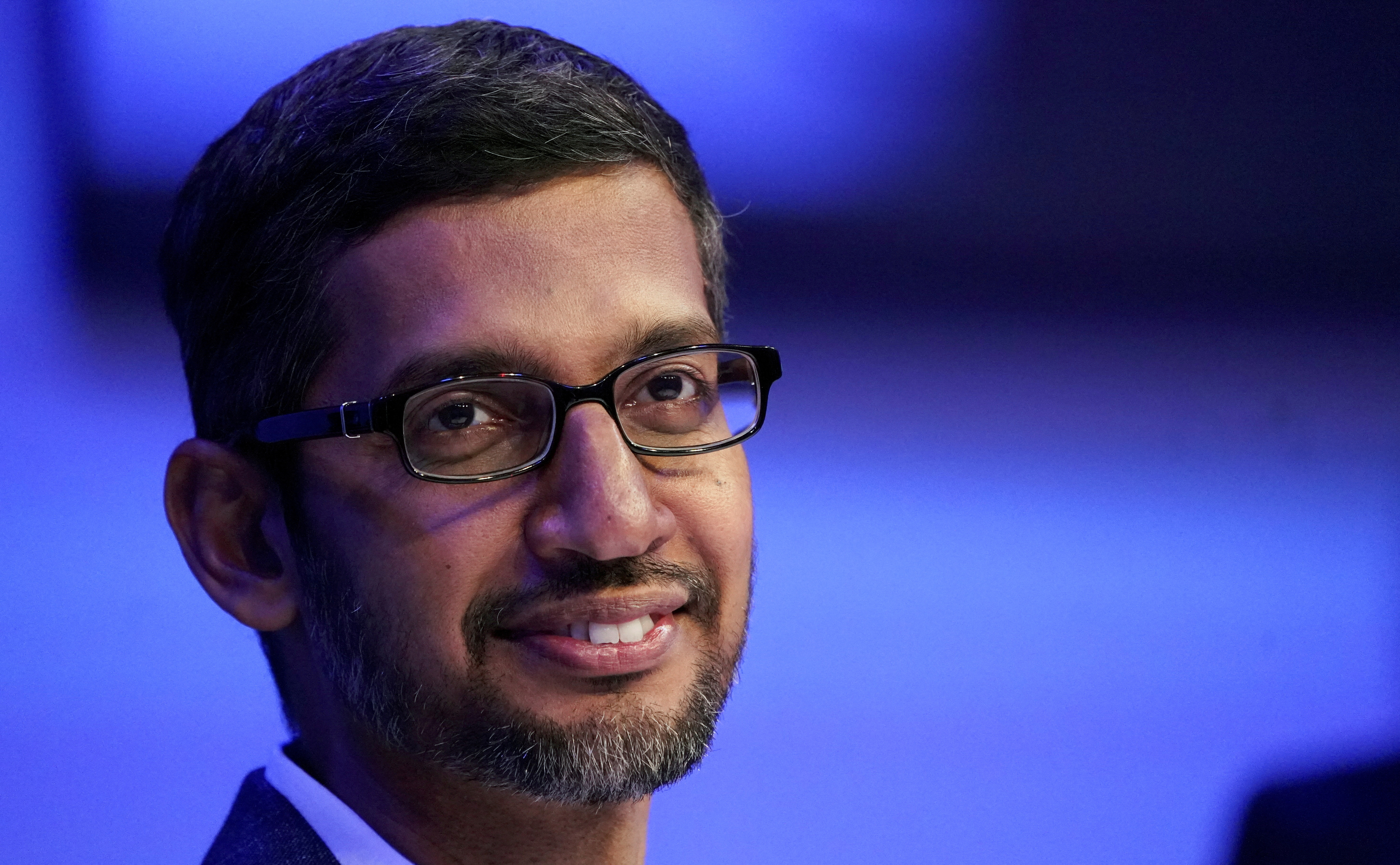Sundar Pichai, chief executive officer of Alphabet, looks on during a session in Davos