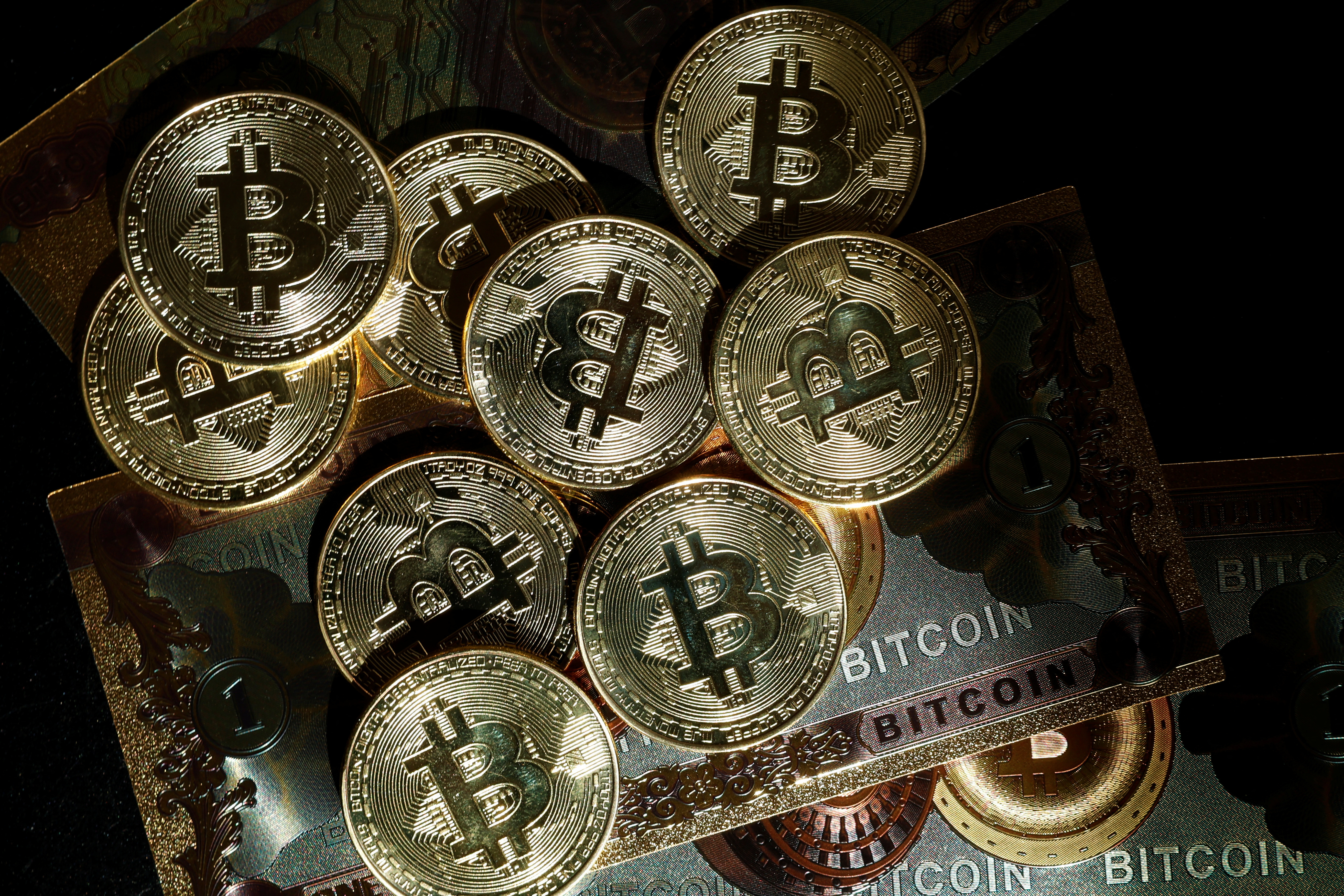Illustration shows representations of cryptocurrency Bitcoin