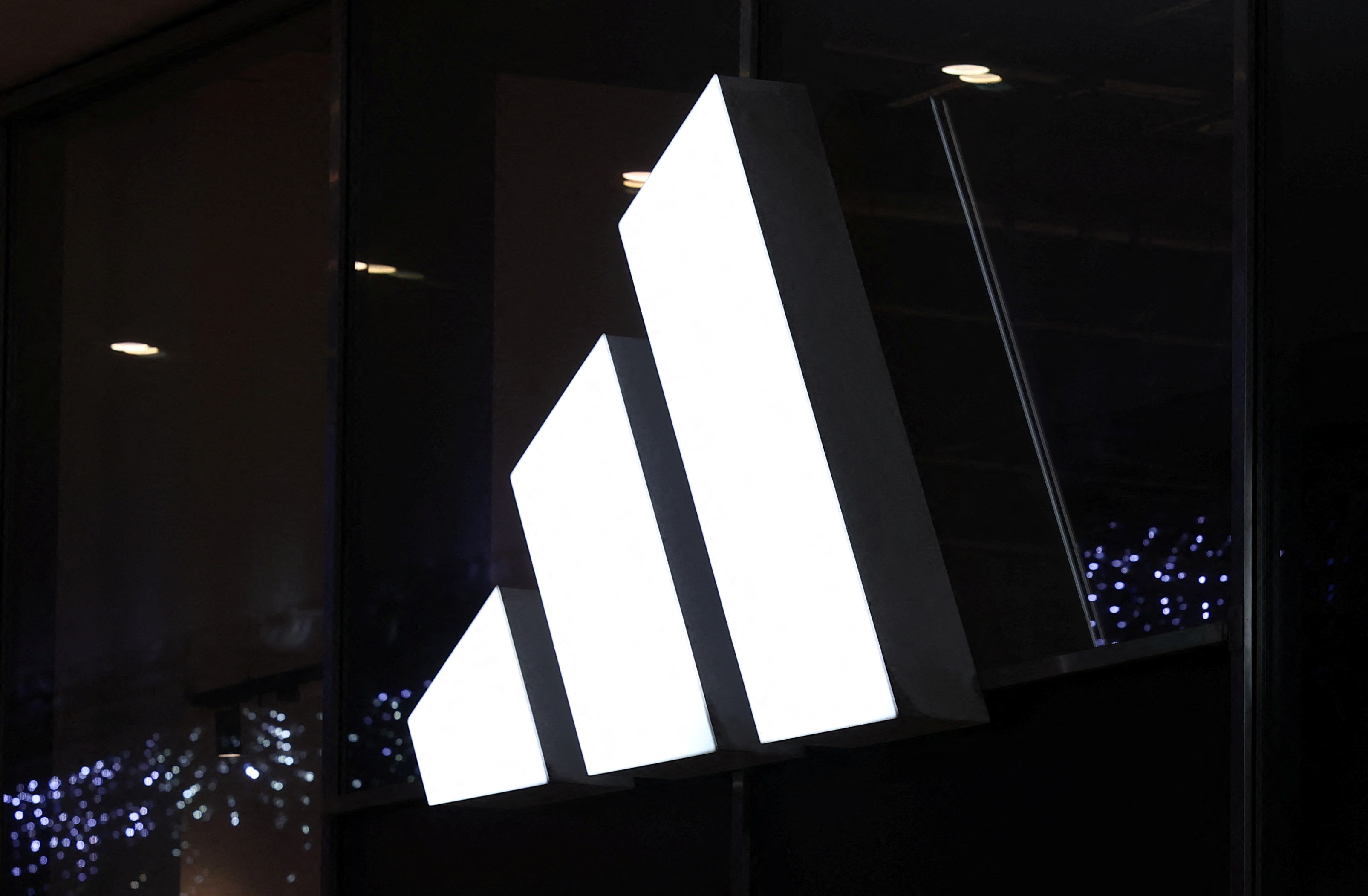 Logo of Adidas brand is displayed on the store in the center of Warsaw