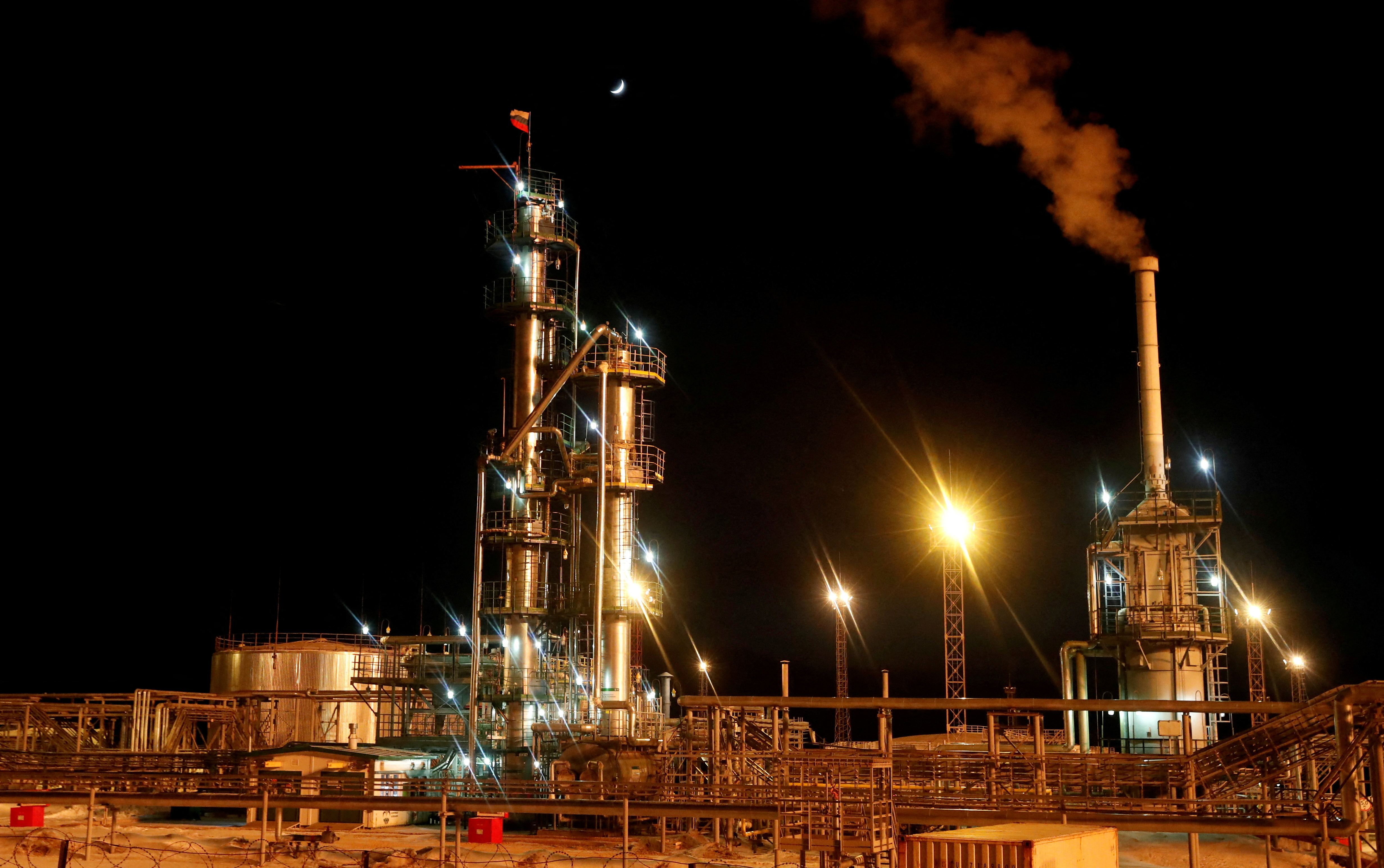 A Russian state flag flies on the top of a diesel plant in the Irkutsk Oil Company-owned Yarakta Oil Field in Irkutsk Region