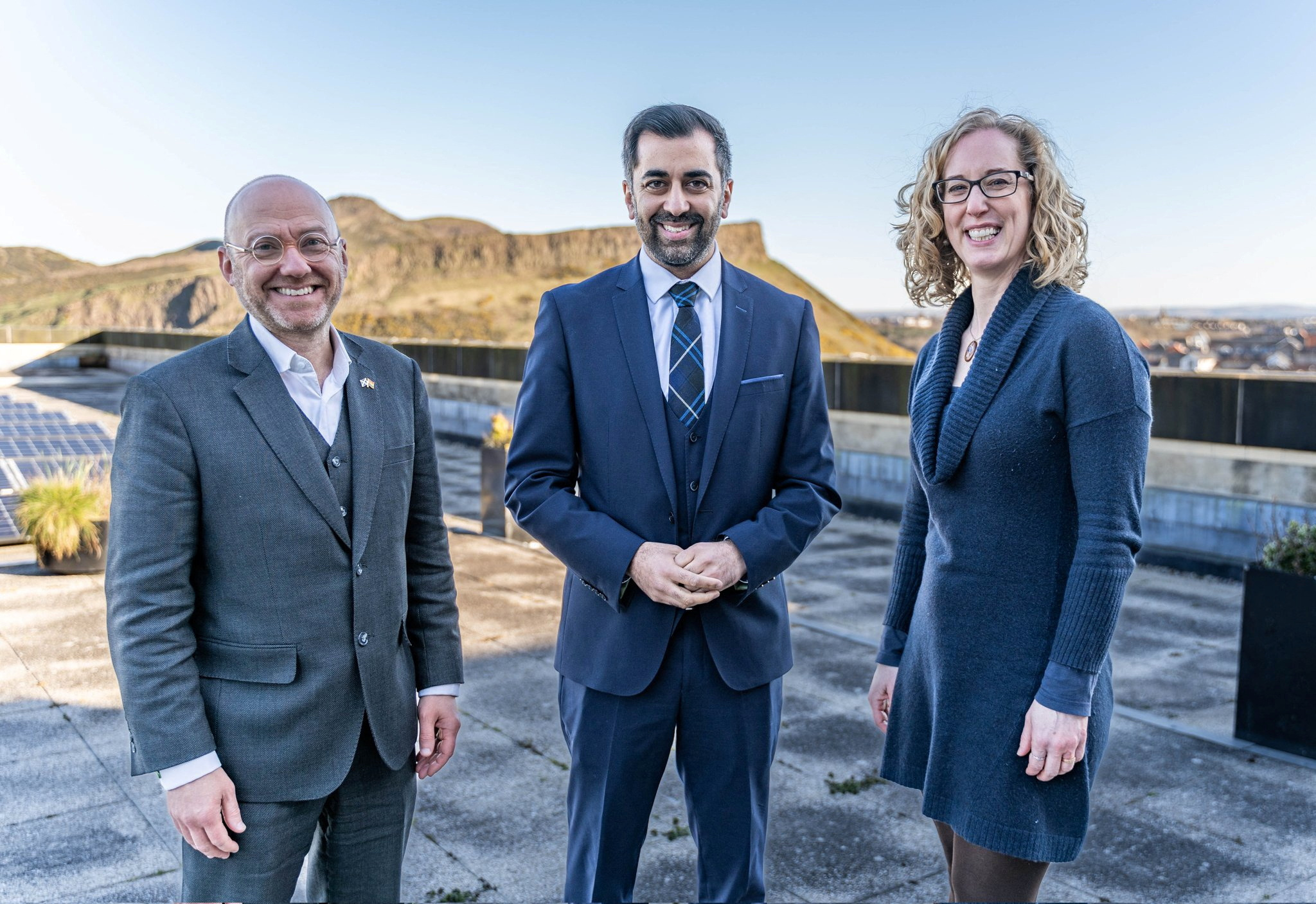 Scottish First Minister Yousaf poses with Greens co-leaders Harvie and Slater in Edinburgh