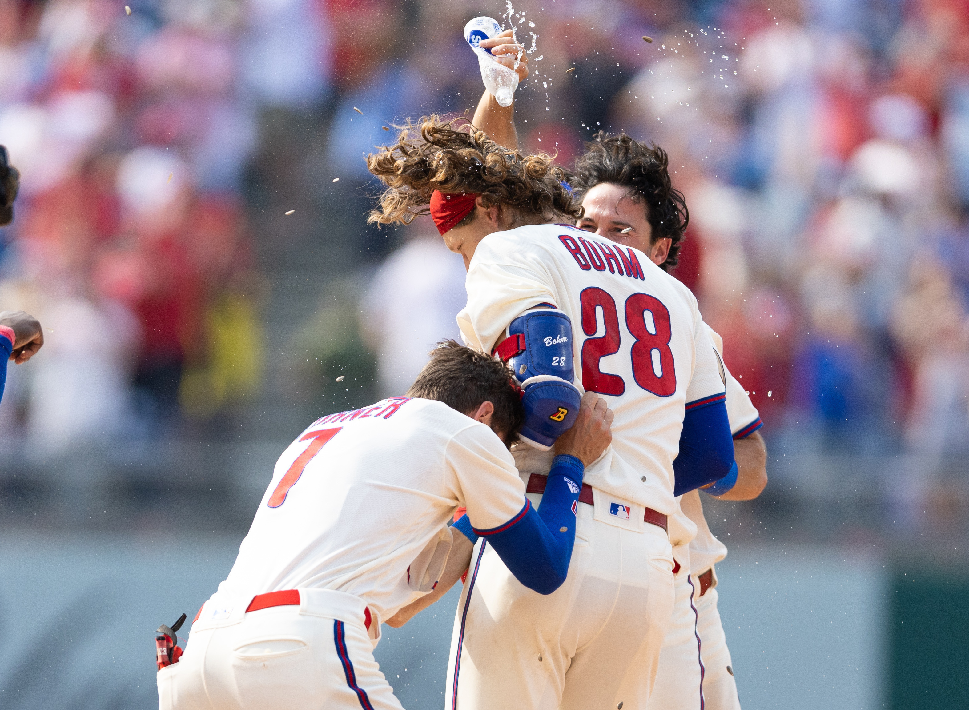 Philadelphia Phillies' Brandon Marsh smiles at Alec Bohm (28