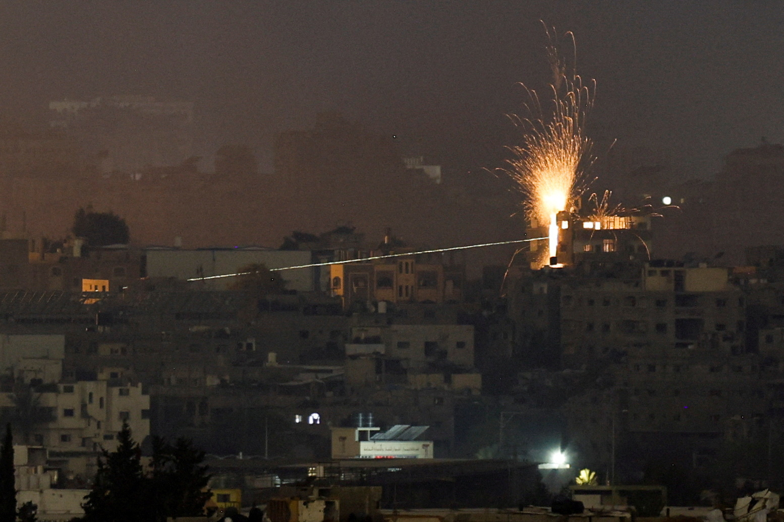 A missile hits a building in northern Gaza