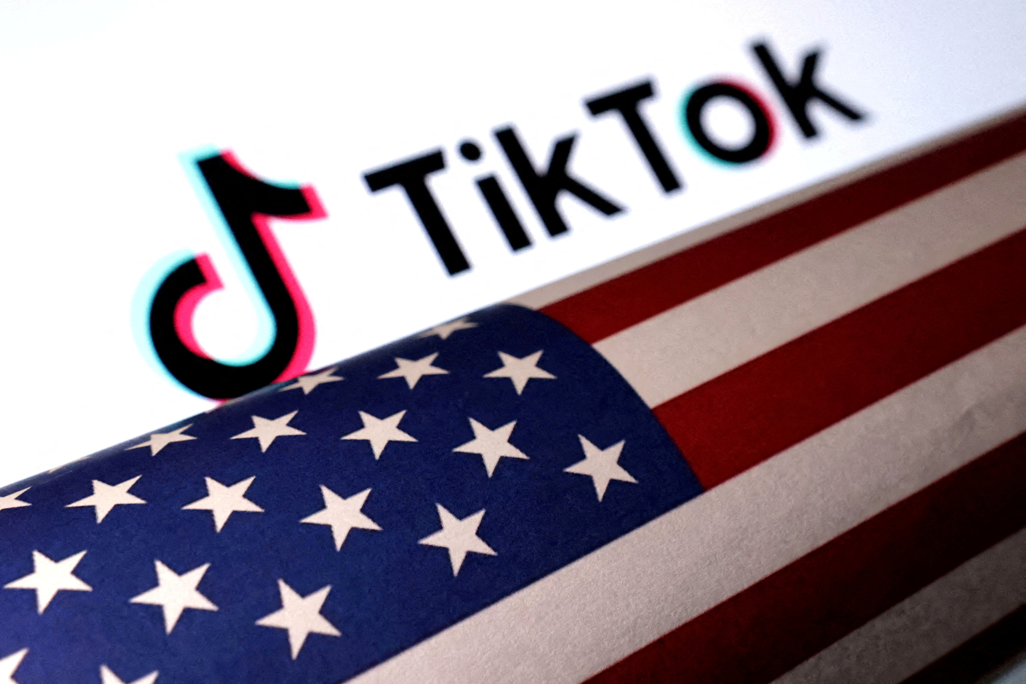 Illustration shows U.S. flag and TikTok logo