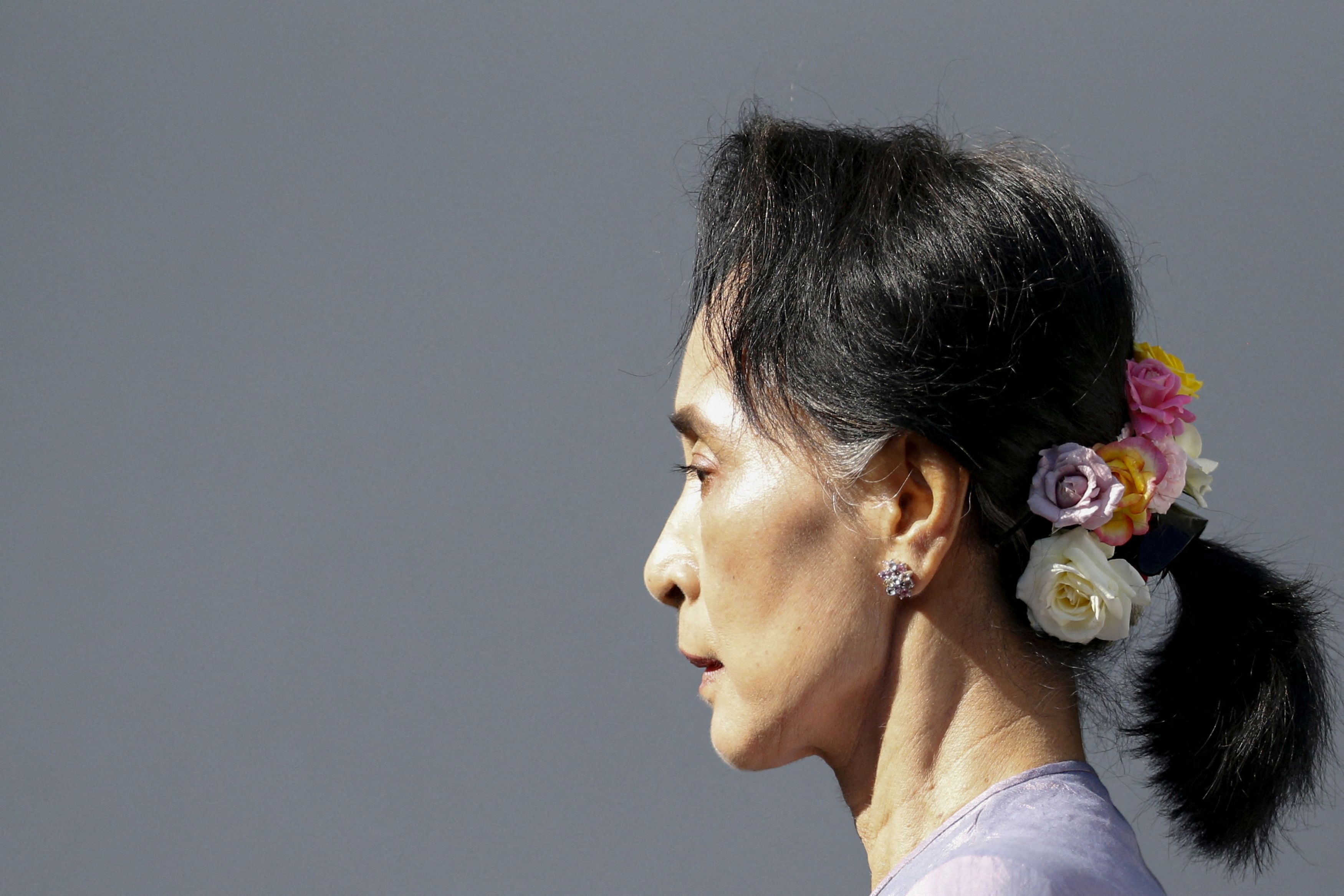 Myanmar's National League for Democracy Party leader Aung San Suu Kyi arrives at a news conference at her home in Yangon