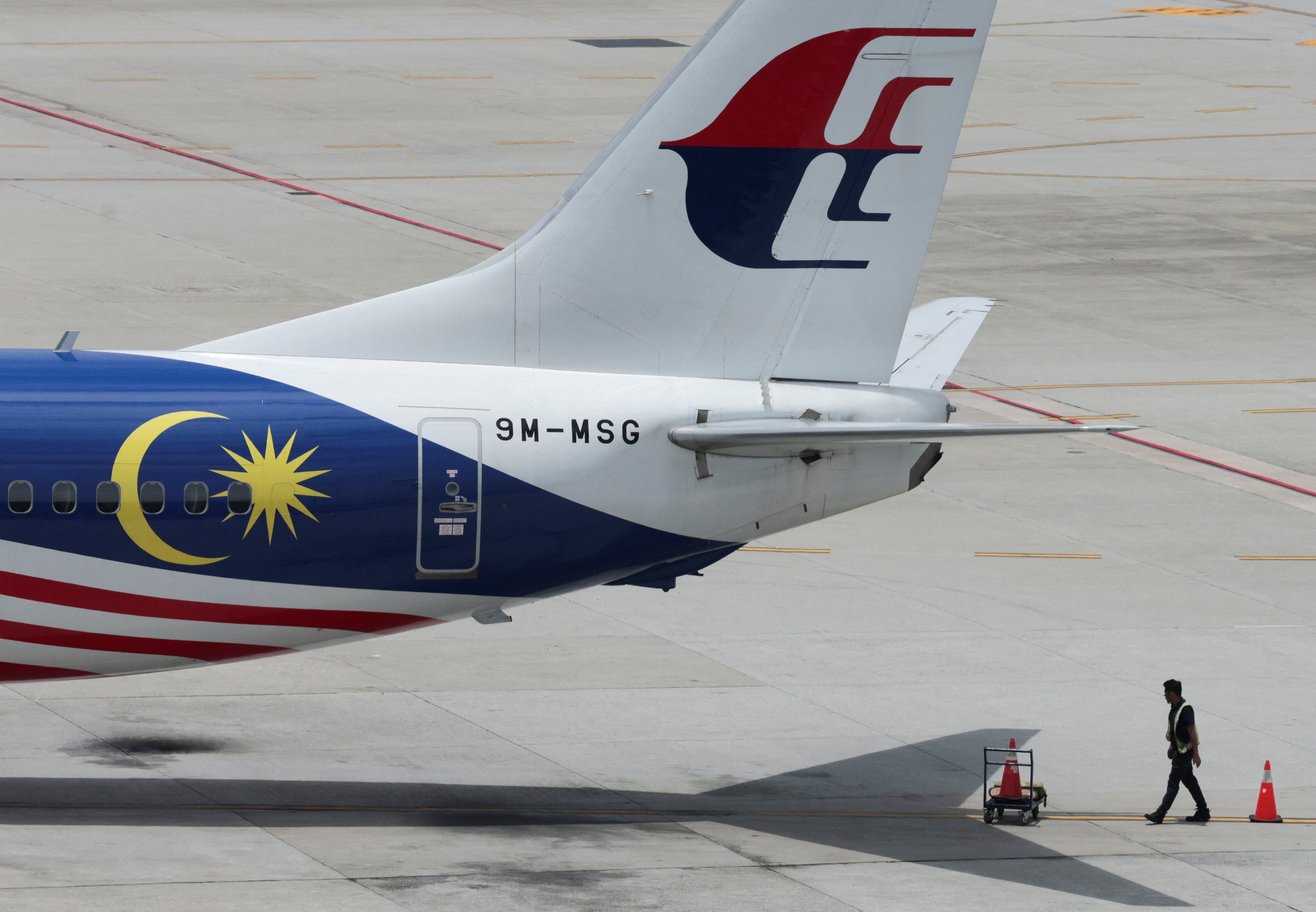 A Malaysia Airlines plane sits on the tarmac at Kuala Lumpur International Airport in Sepang