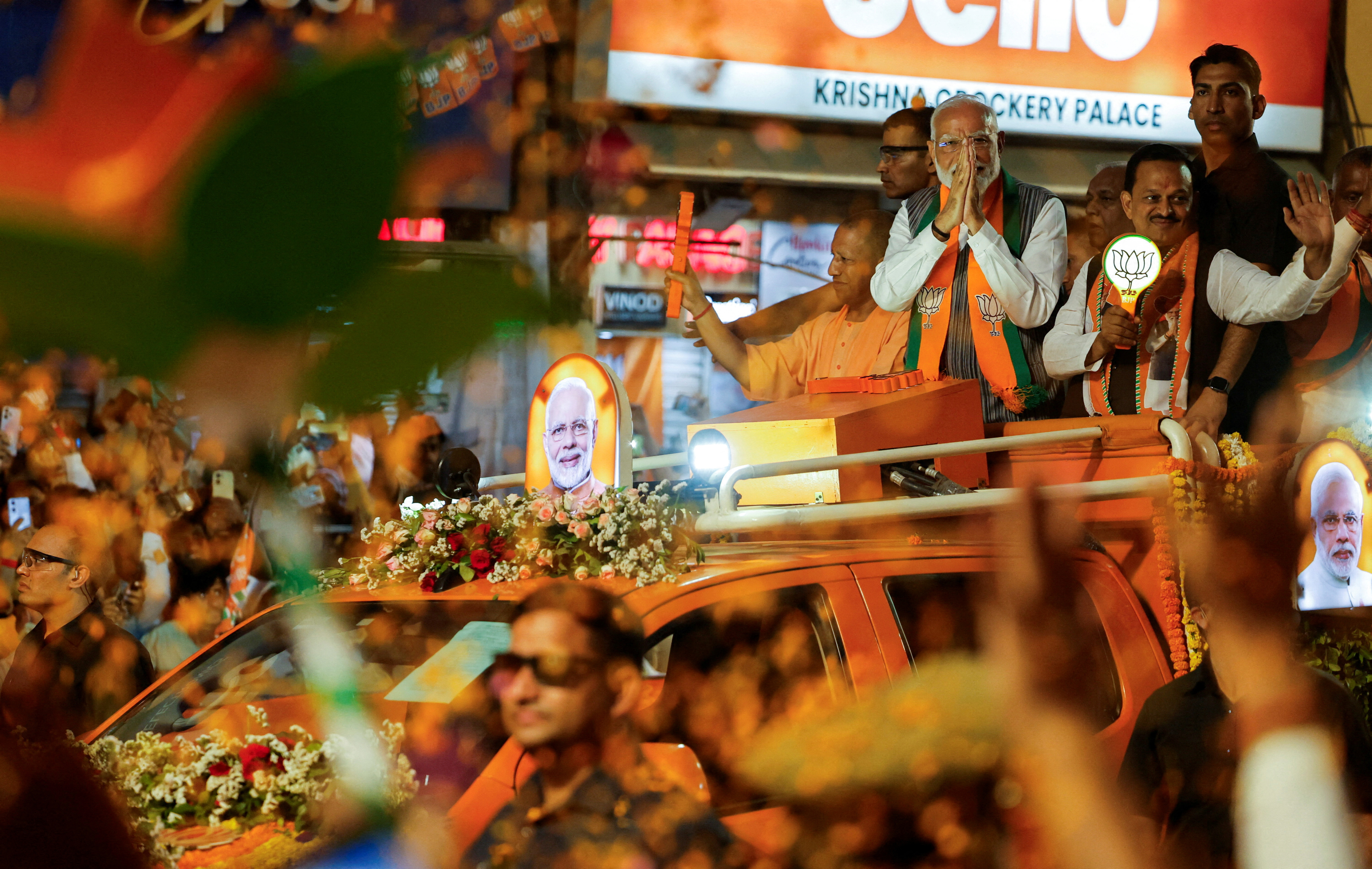 India's Prime Minister Narendra Modi and Chief Minister of Uttar Pradesh, Yogi Adityanath attend an election campaign rally in Kanpur