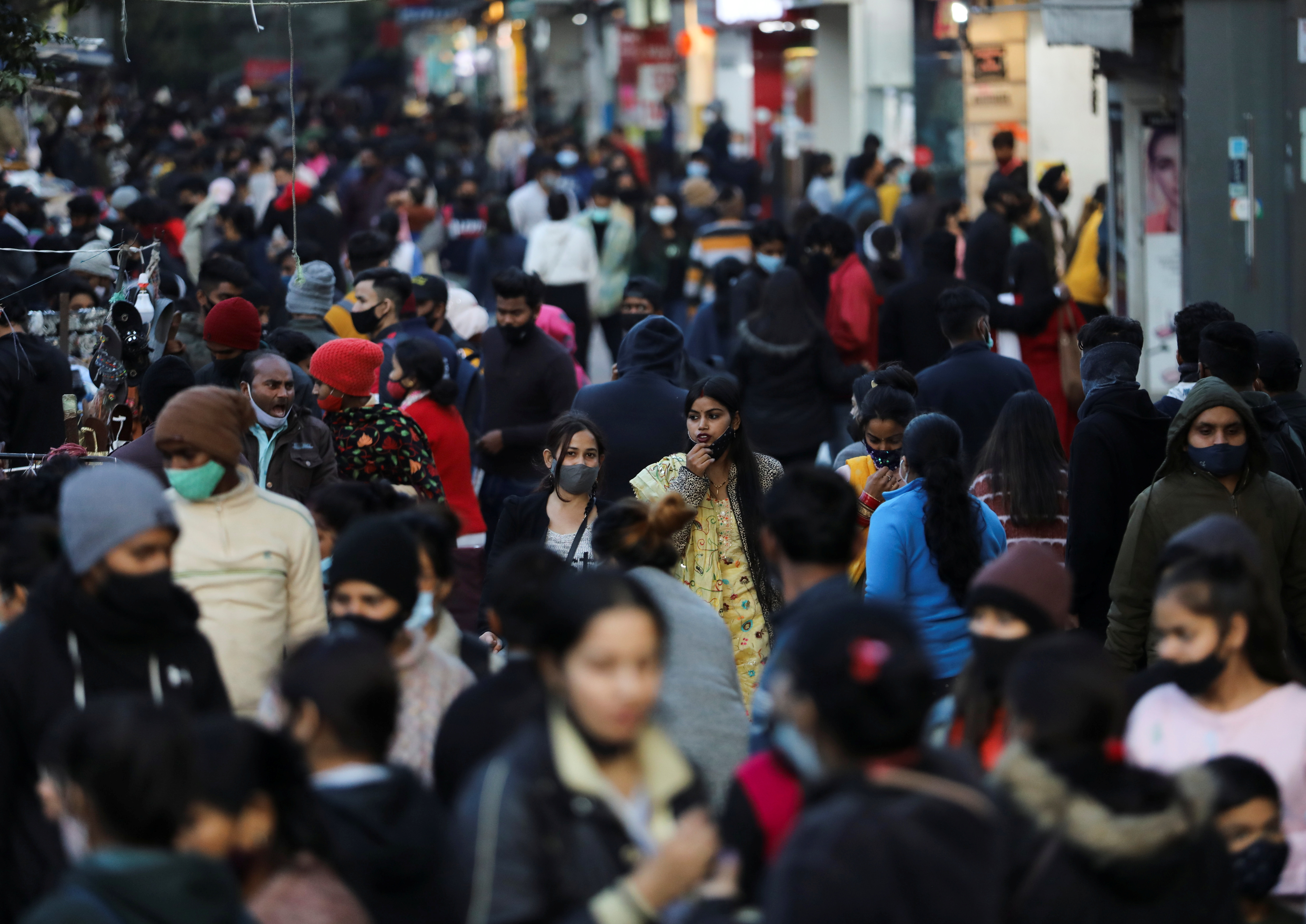 People shop at a market amidst the spread of coronavirus disease (COVID-19) in New Delhi