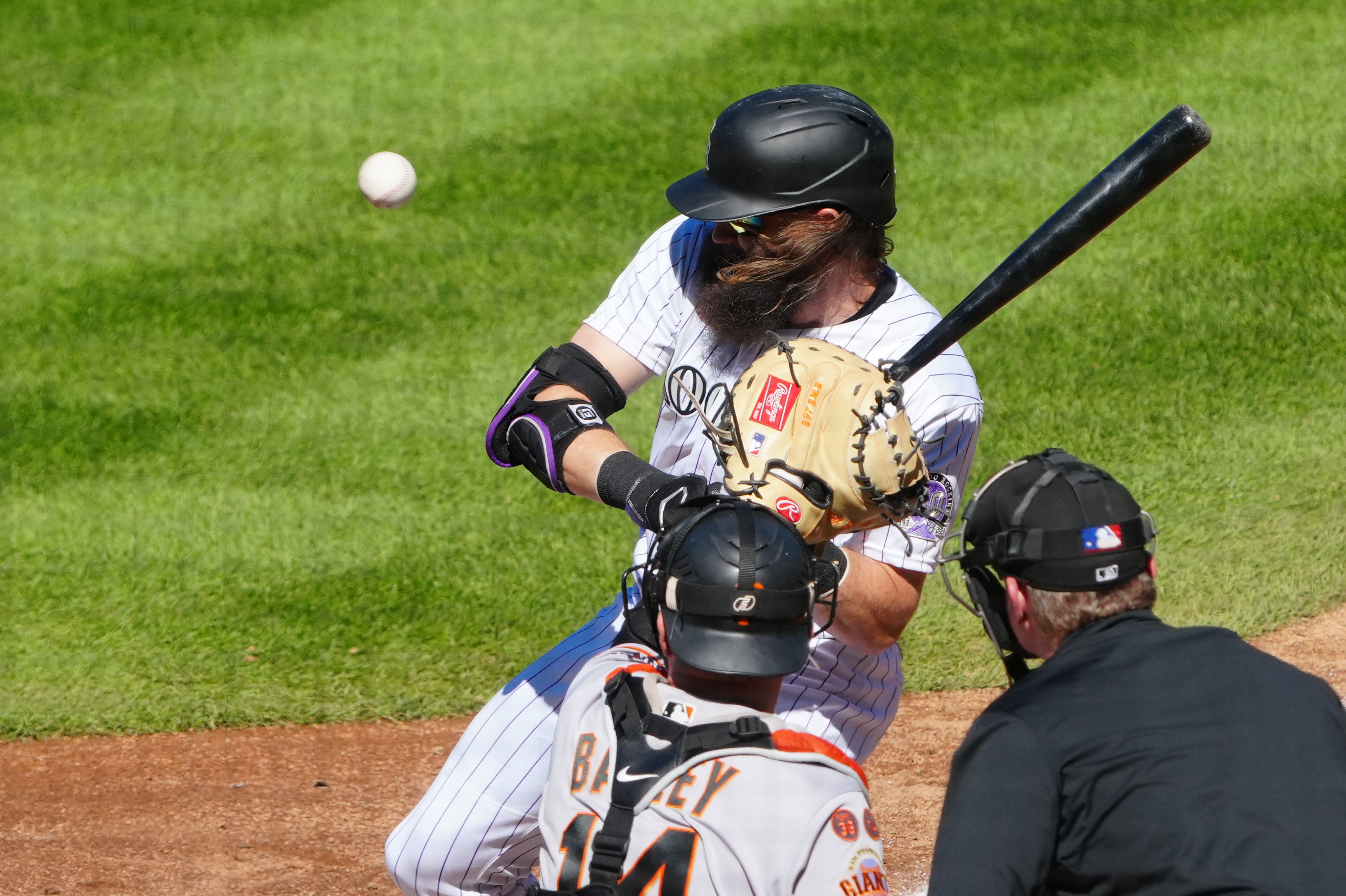 Giants open 9-run lead, hang to to beat Rockies 11-10 and stop slide