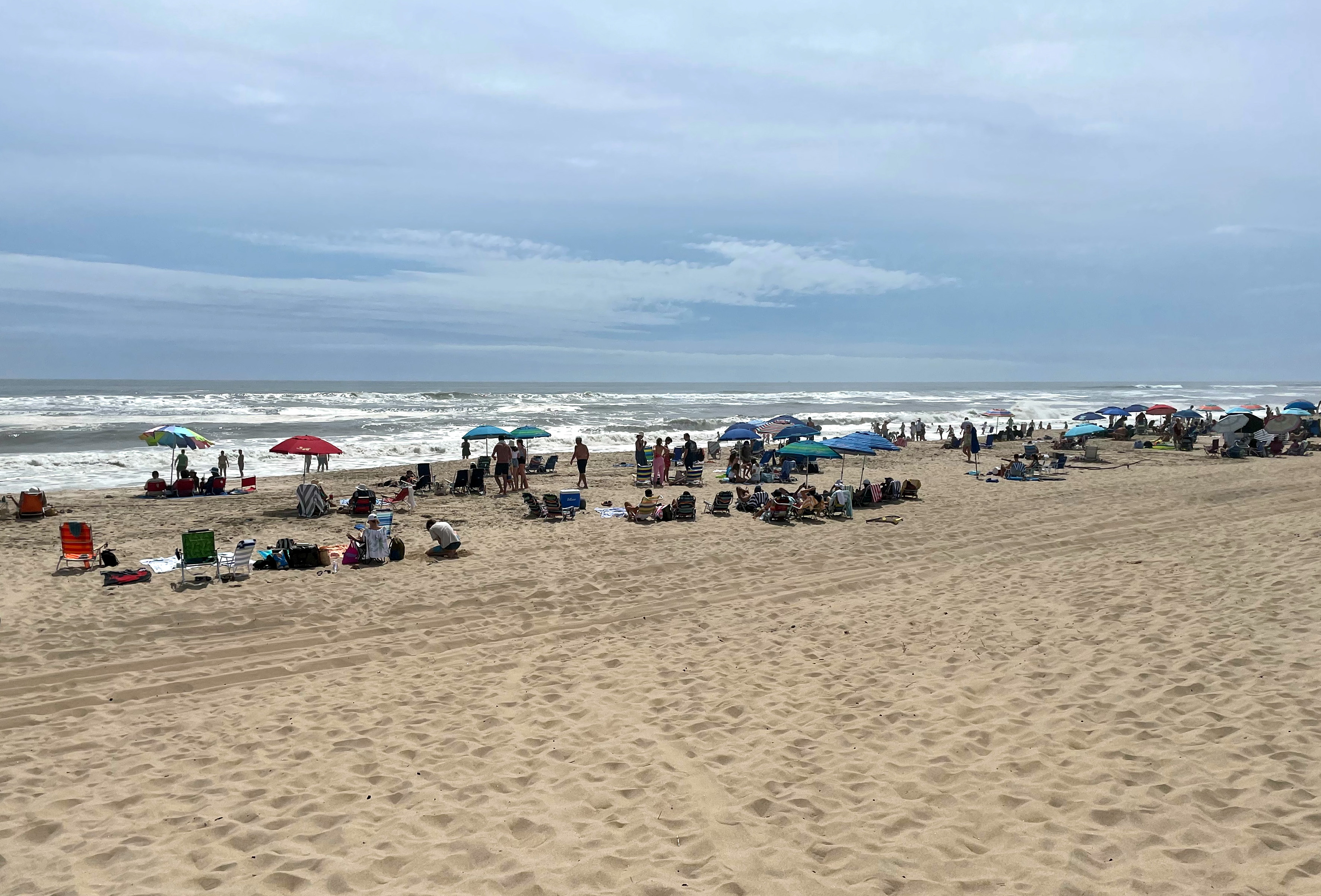Residents and holiday makers in the Hamptons make the most of the calm before the storm at Atlantic Avenue beach ahead of Hurricane Henri's landfall, Long Island, New York, U.S., August 21, 2021. REUTERS/Leela de Kretser