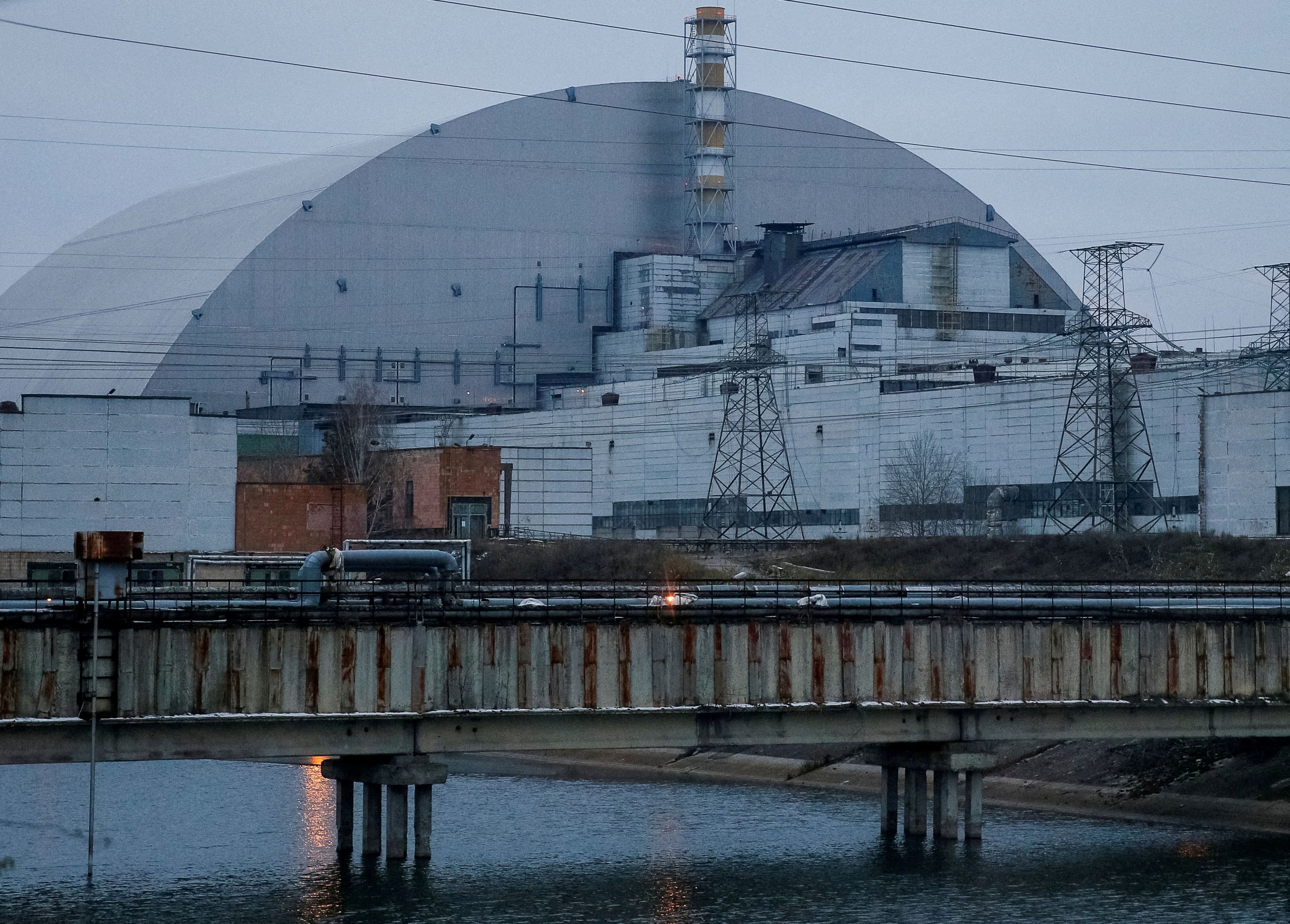 A general view shows the New Safe Confinement structure over the old sarcophagus covering the damaged fourth reactor at the Chernobyl Nuclear Power Plant, in Chernobyl
