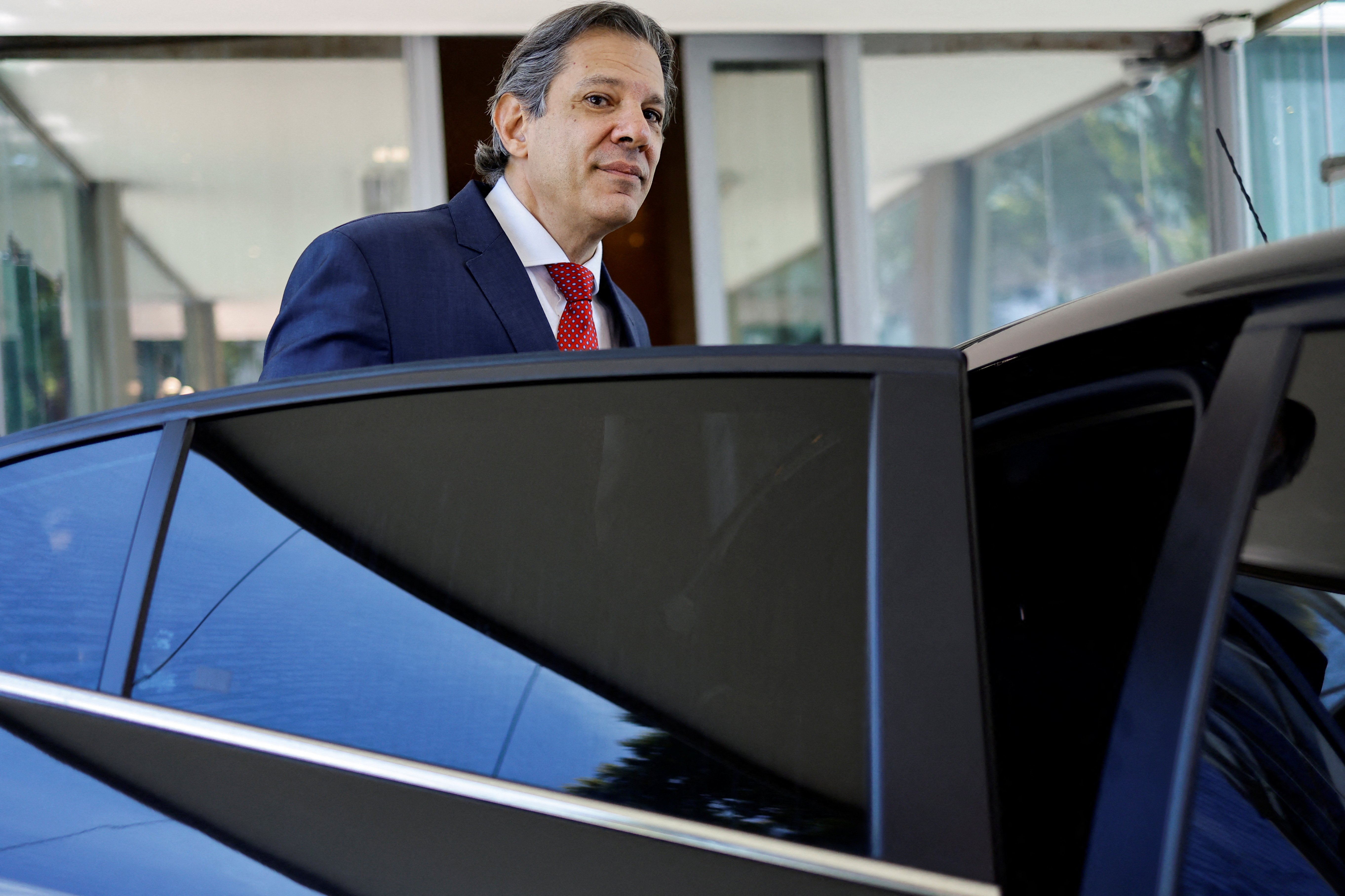 Brazil's Finance Minister Fernando Haddad leaves the Ministry of Finance after a press conference, in Brasilia