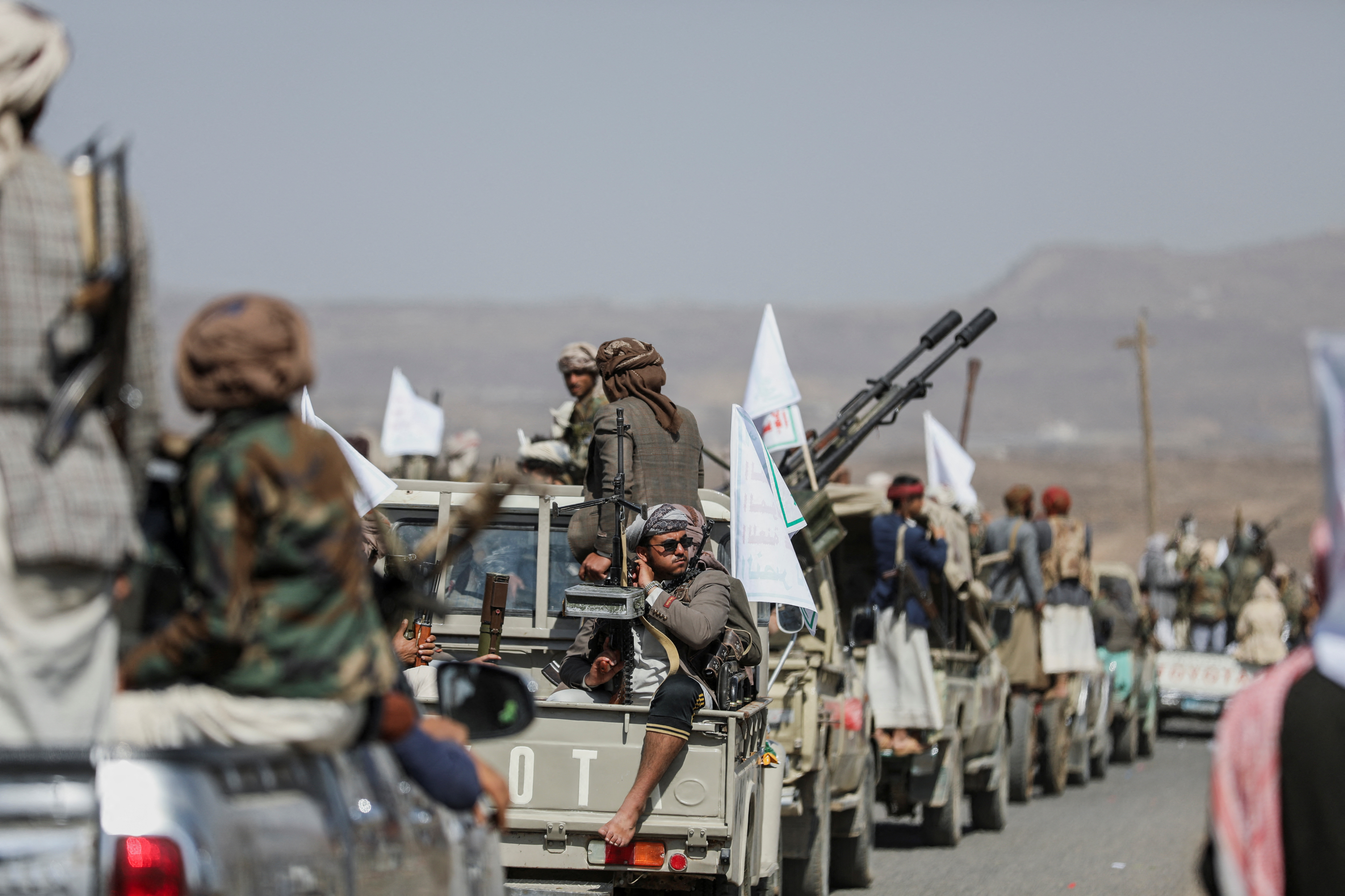 Houthi tribesmen gather to show defiance after U.S. and U.K air strikes on Houthi positions near Sanaa