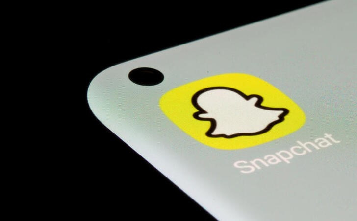 Snapchat app is seen on a smartphone in this illustration