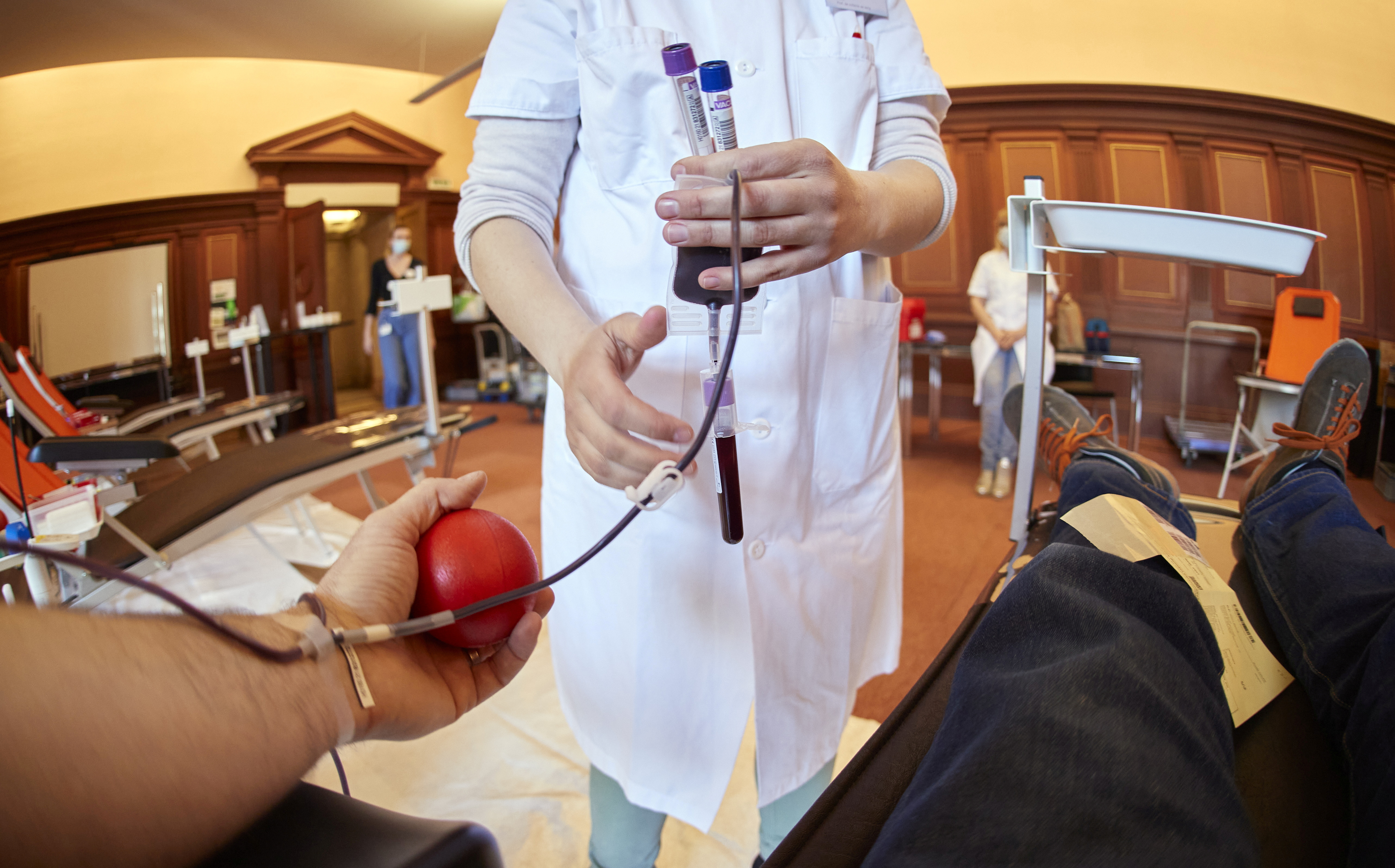 A nurse collects samples at a blood donation centre in Lausanne