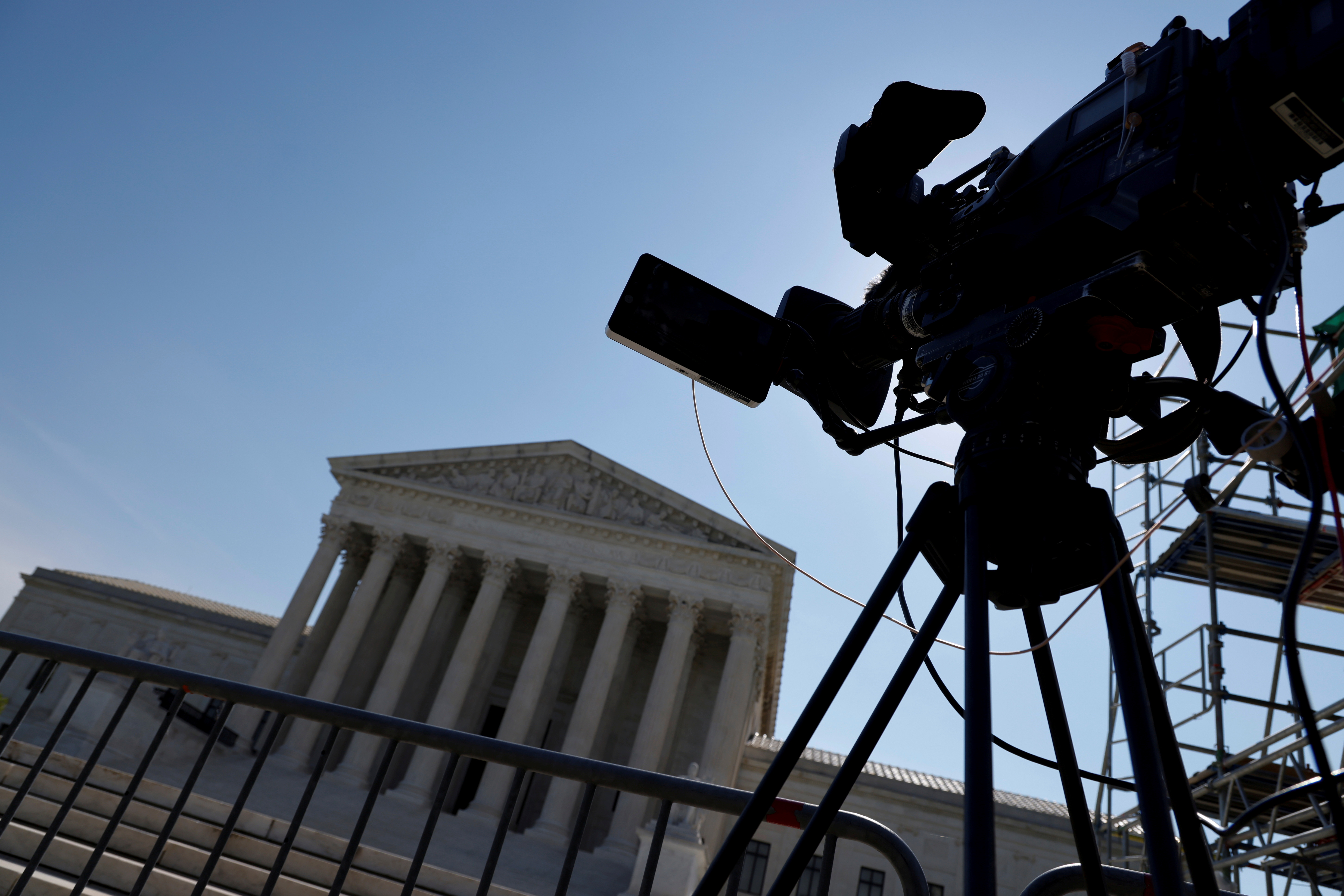 A lone network television camera is trained on the U.S. Supreme Court building in Washington