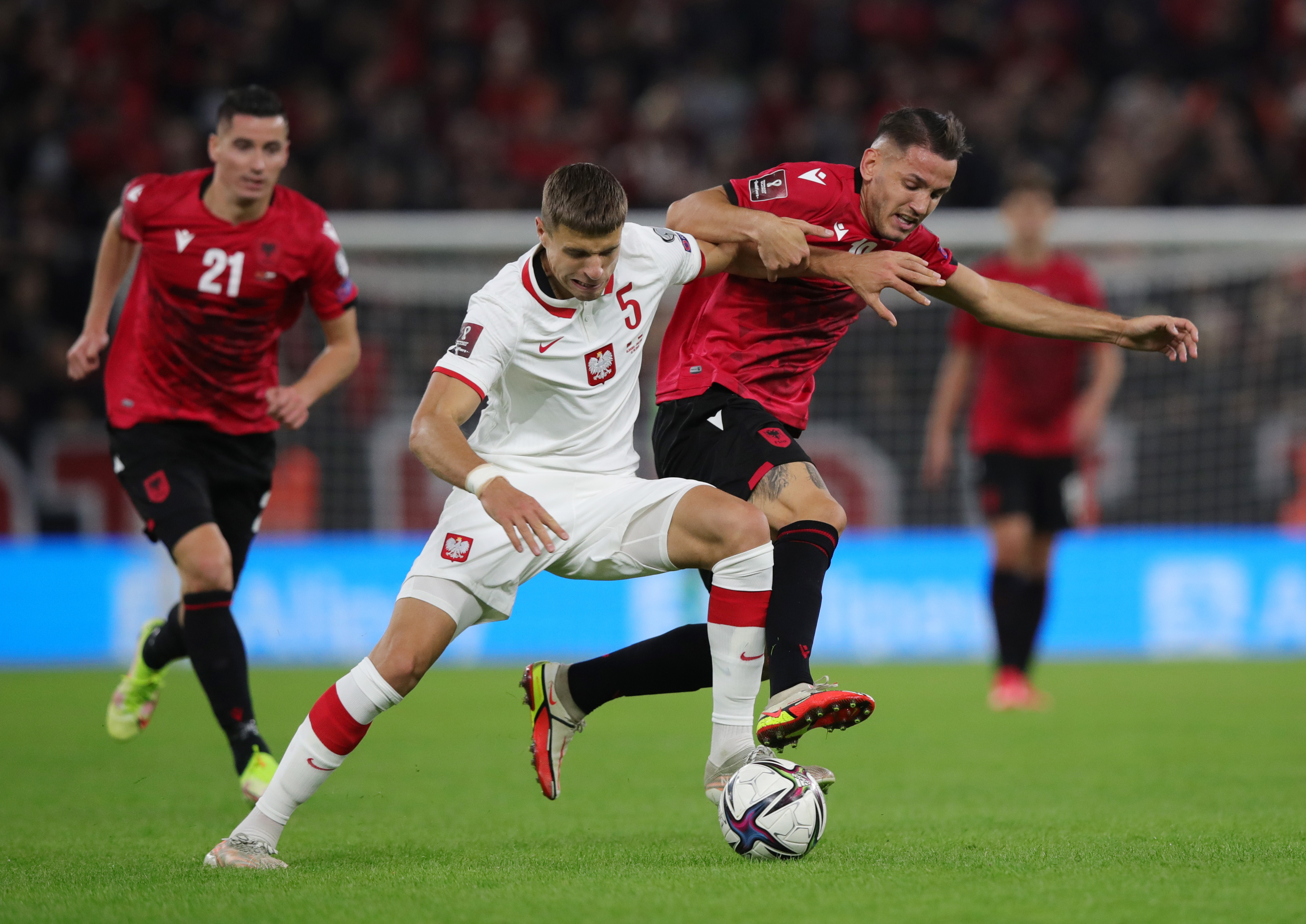 Poland boost hopes with 1-0 win in Albania after crowd trouble | Reuters