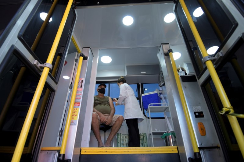 A bus turned into a mobile vaccination center helps population in Minas Gerais state during pandemic, in Ouro Branco