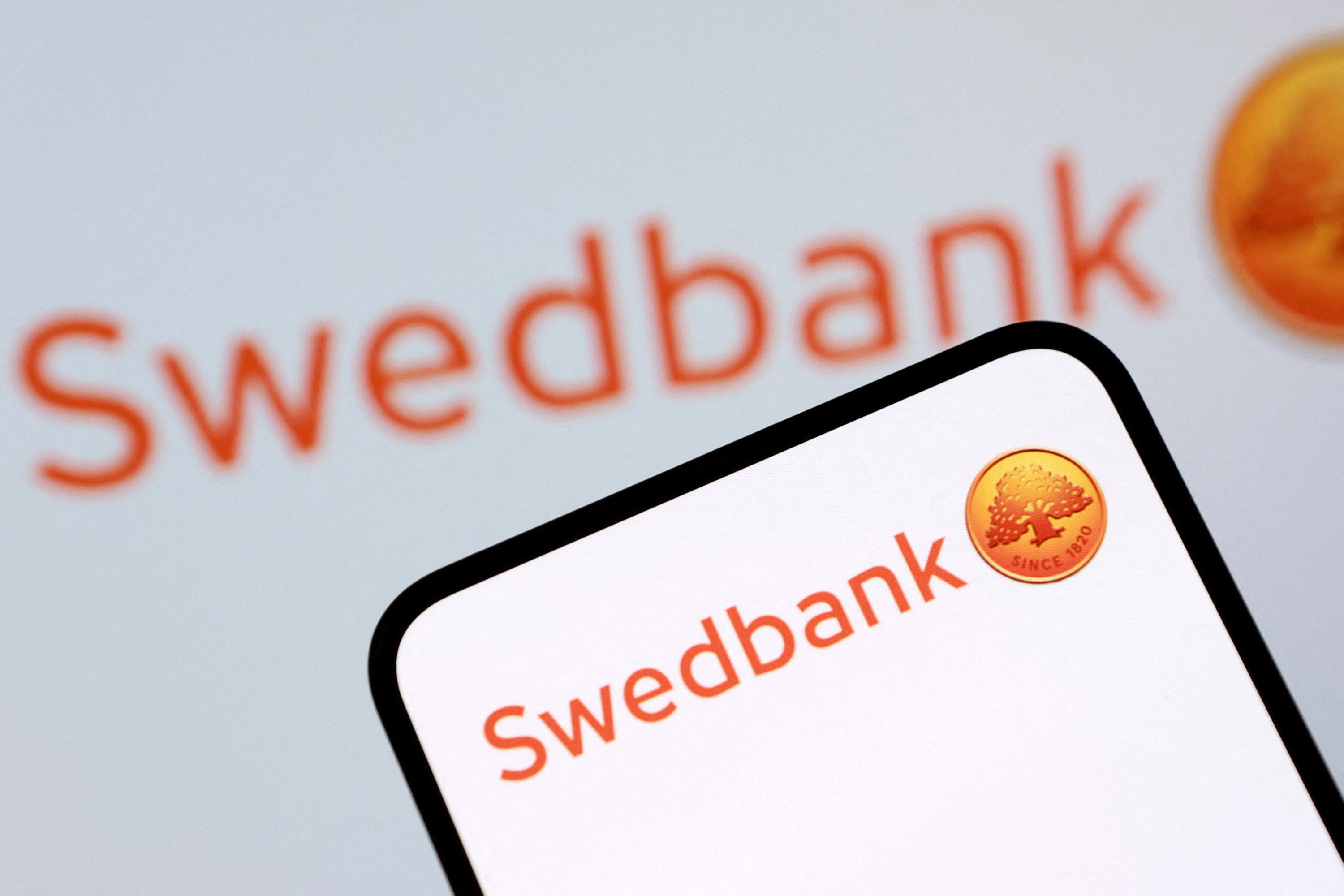 Swedbank shares jump after DOJ closes investigation | Reuters