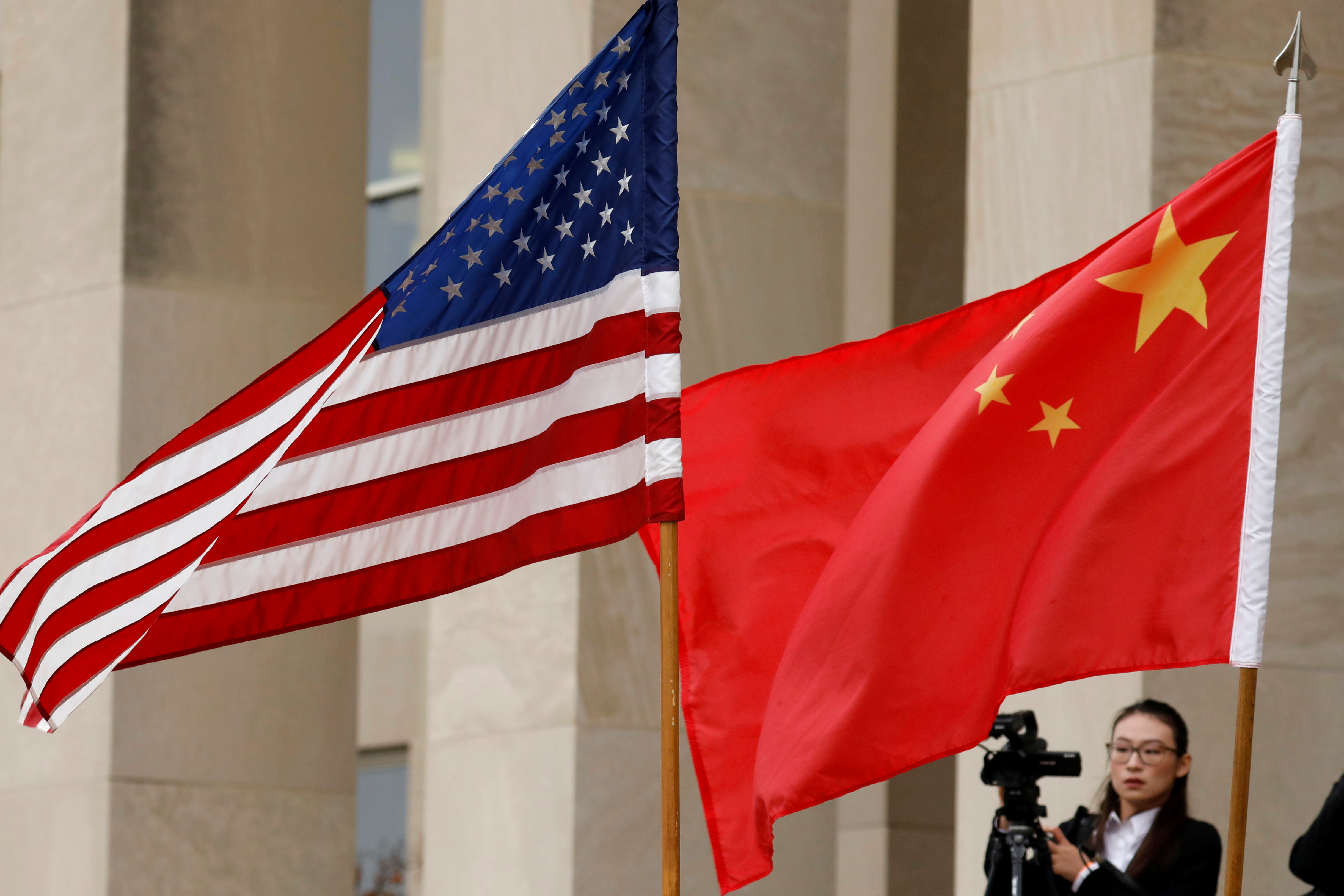 U.S. and Chinese flags are seen before a meeting between senior defence officials from both countries at the Pentagon in Arlington, Virginia, U.S., November 9, 2018. REUTERS/Yuri Gripas