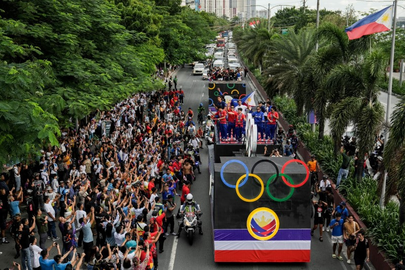 Philippines cheers gold medallist gymnast Yulo in victory parade Reuters