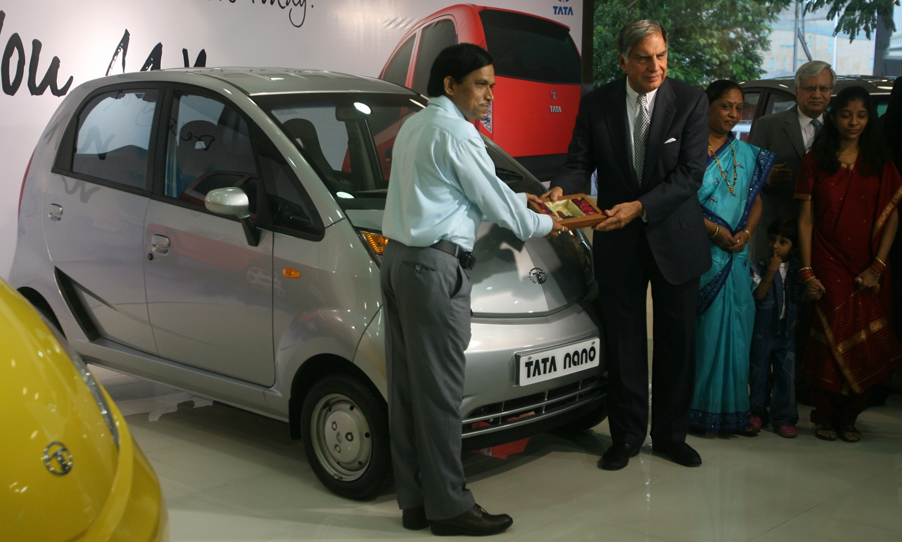 Tata presents keys to  Vichare at a Nano showroom in Mumbai