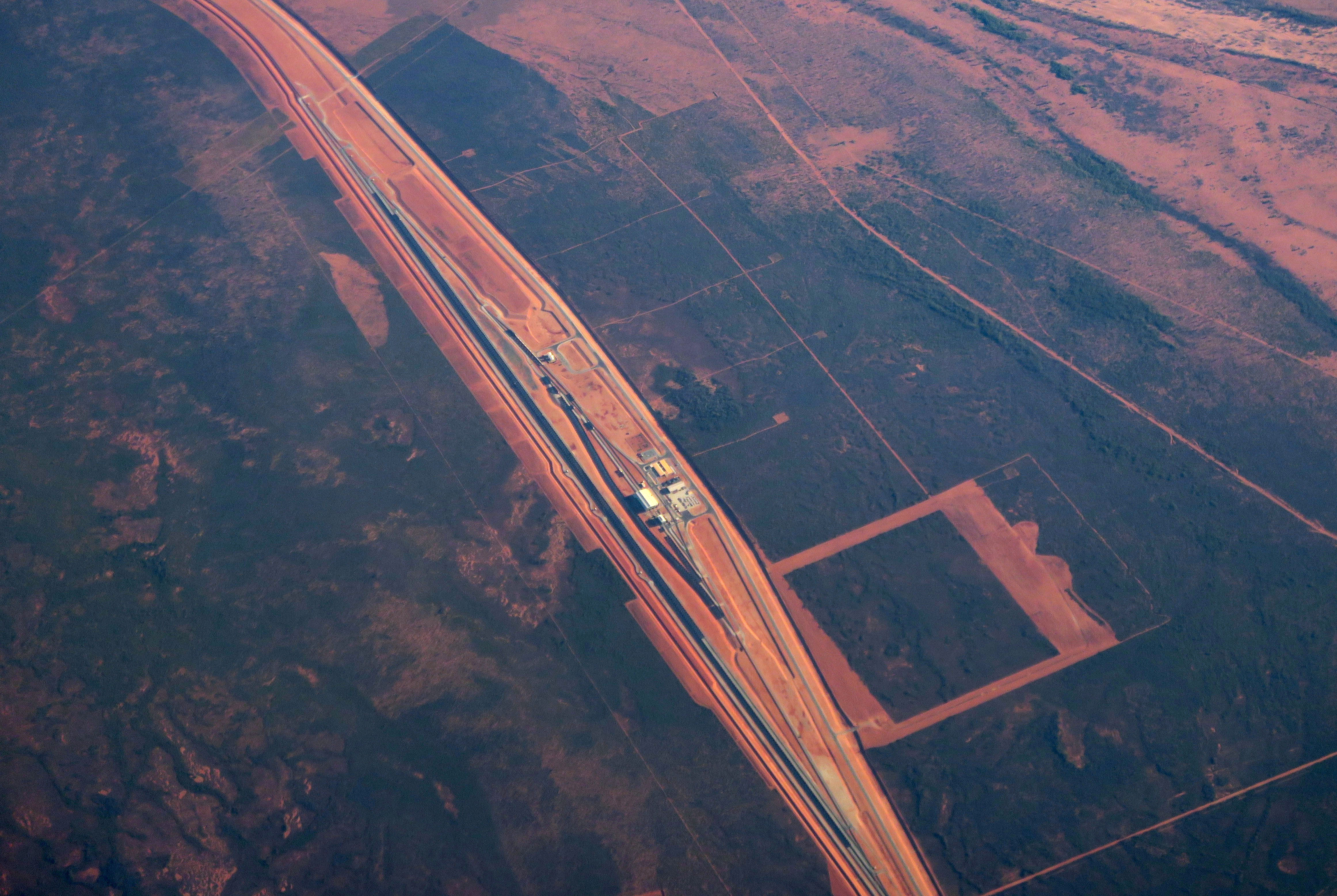 Iron ore mining operations, including a rail network, can be seen in outback Western Australia near the city of Port Hedland