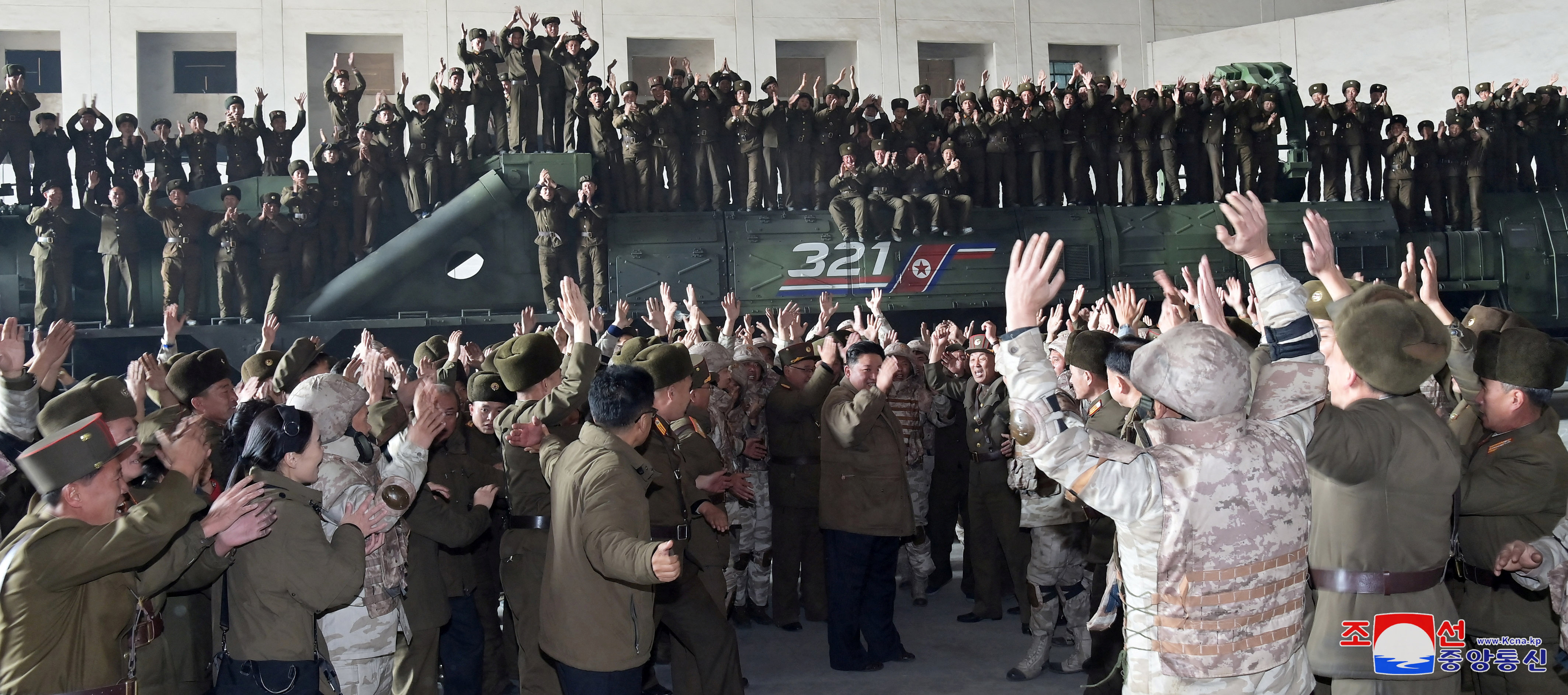 North Korean leader Kim Jong Un celebrates on the day of the launch of an ICBM in this undated photo released by KCNA