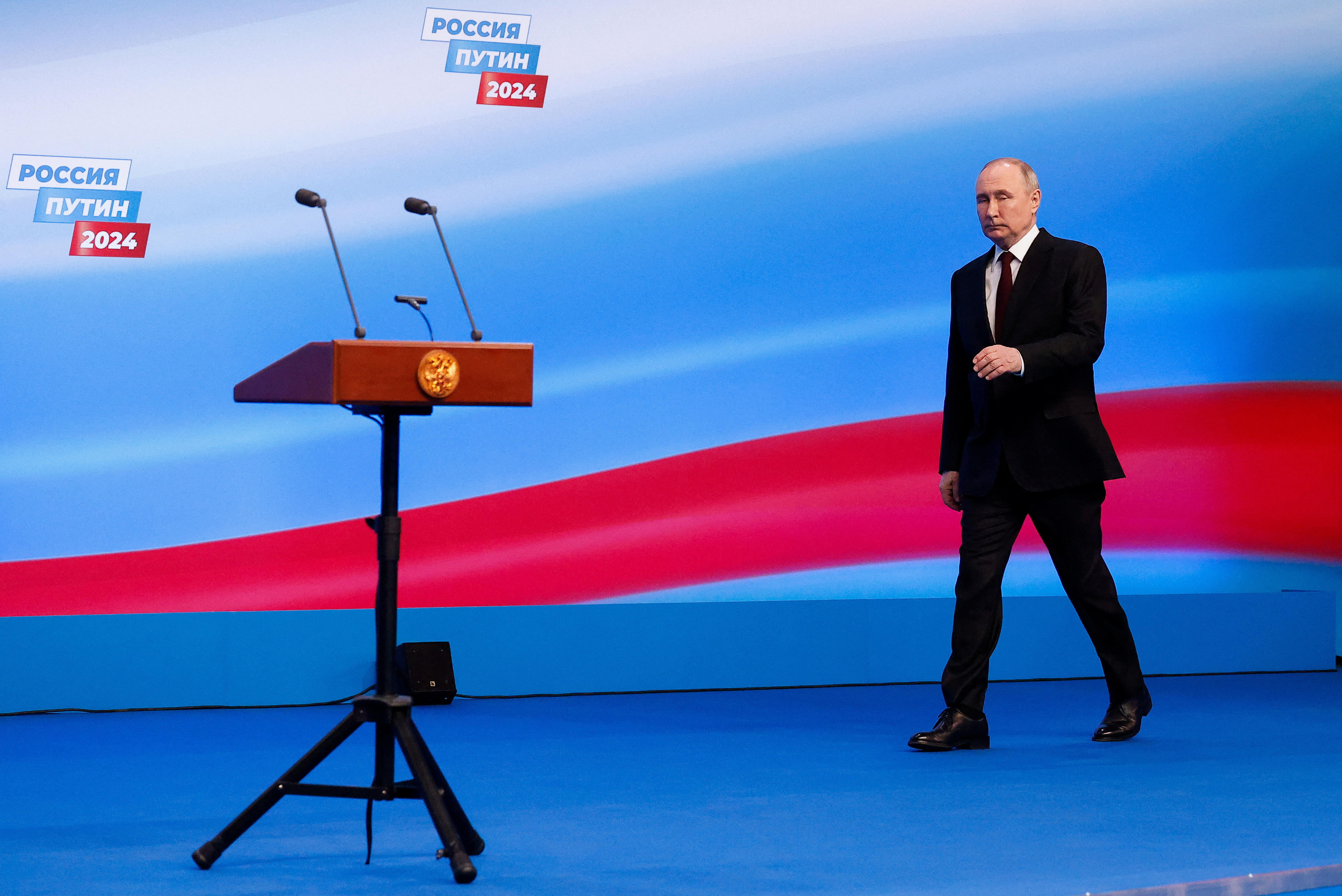 Russian incumbent President Putin visits his election campaign headquarters in Moscow