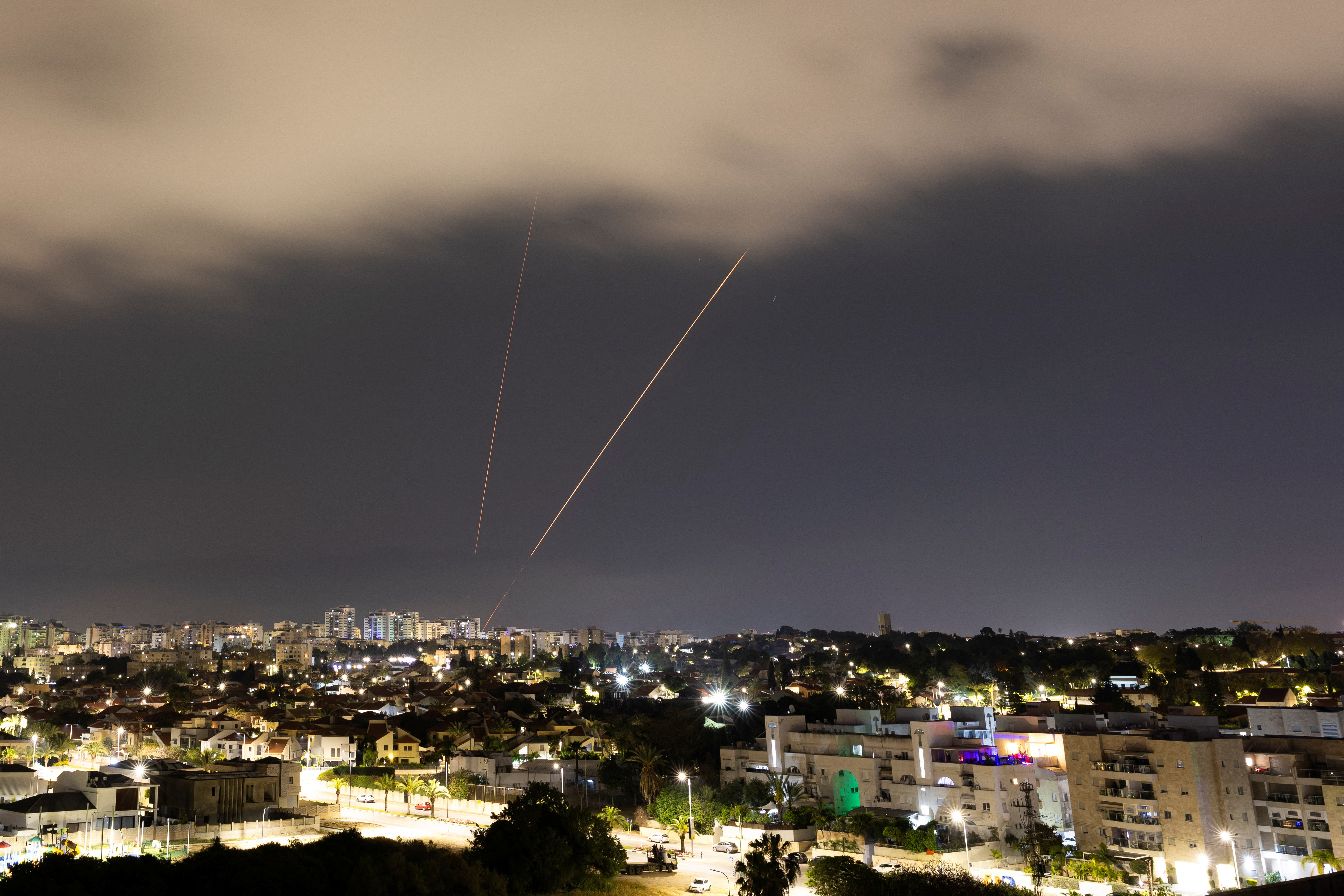 An anti-missile system operates after Iran launched drones and missiles towards Israel, as seen from Ashkelon