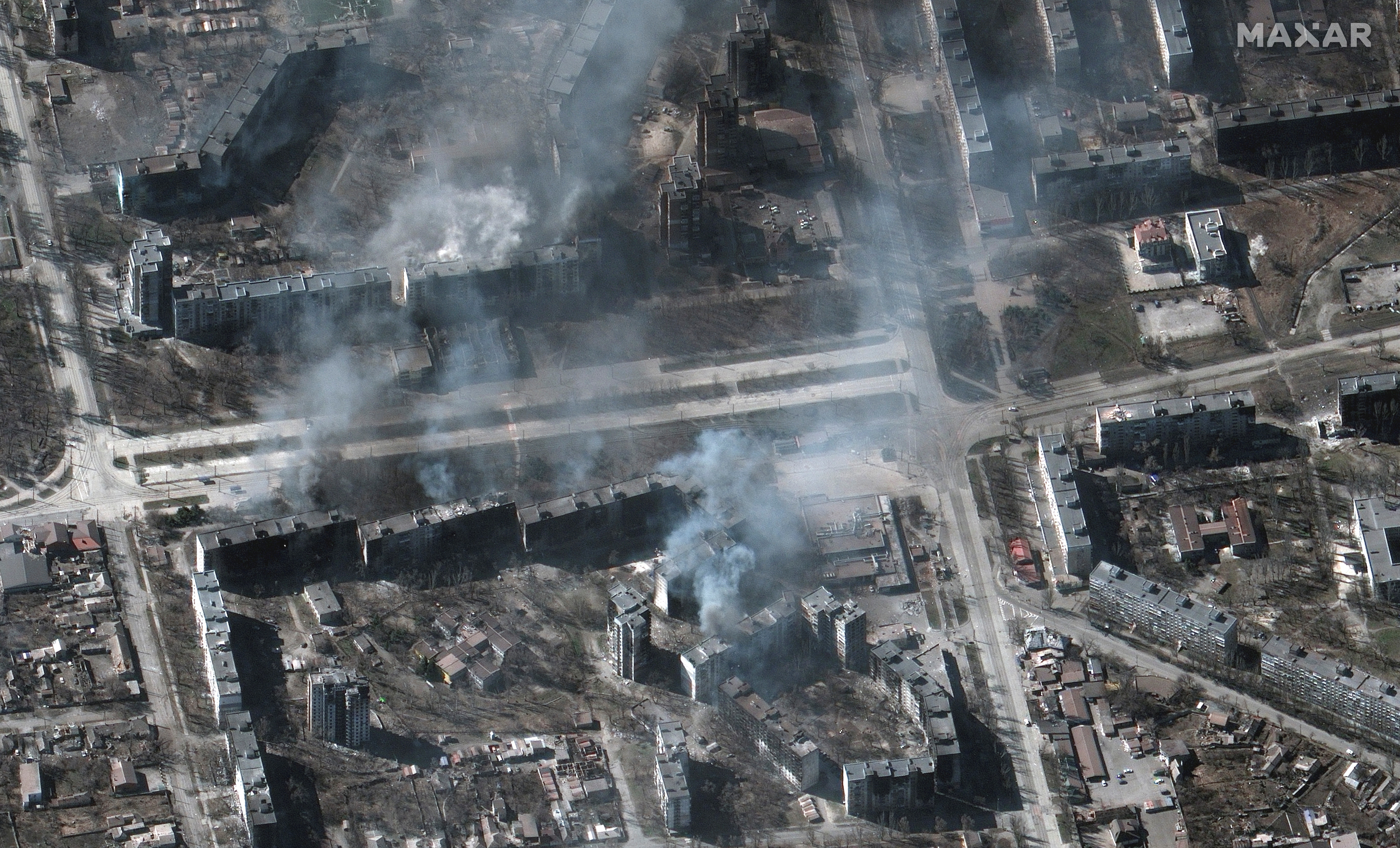 A satellite image shows buildings on fire, in Mariupol