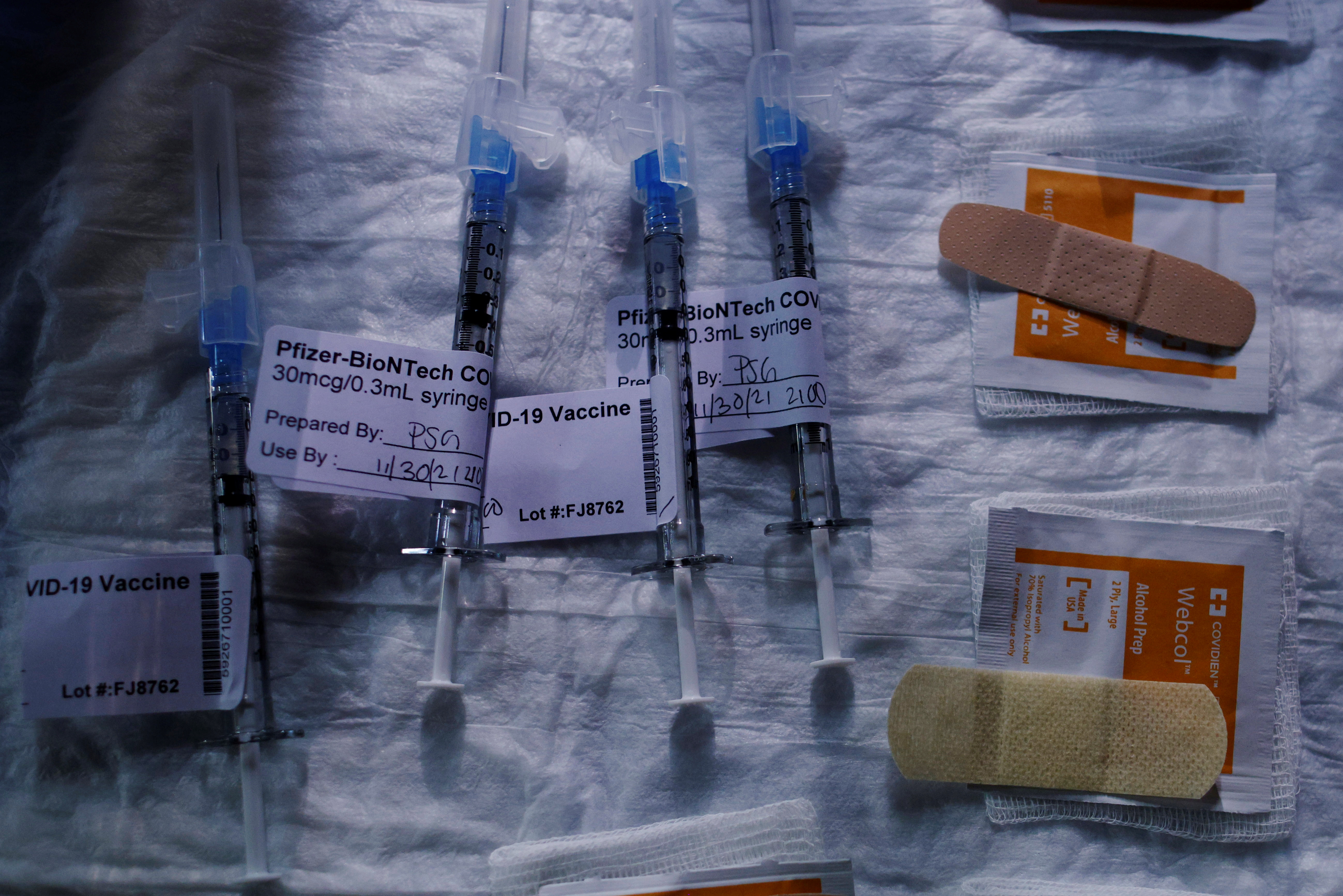 Syringes with a dose of the coronavirus disease (COVID-19) vaccine are ready for injections at a vaccine clinic at La Colaborativa in Chelsea, Massachusetts, U.S., November 30, 2021.   REUTERS/Brian Snyder