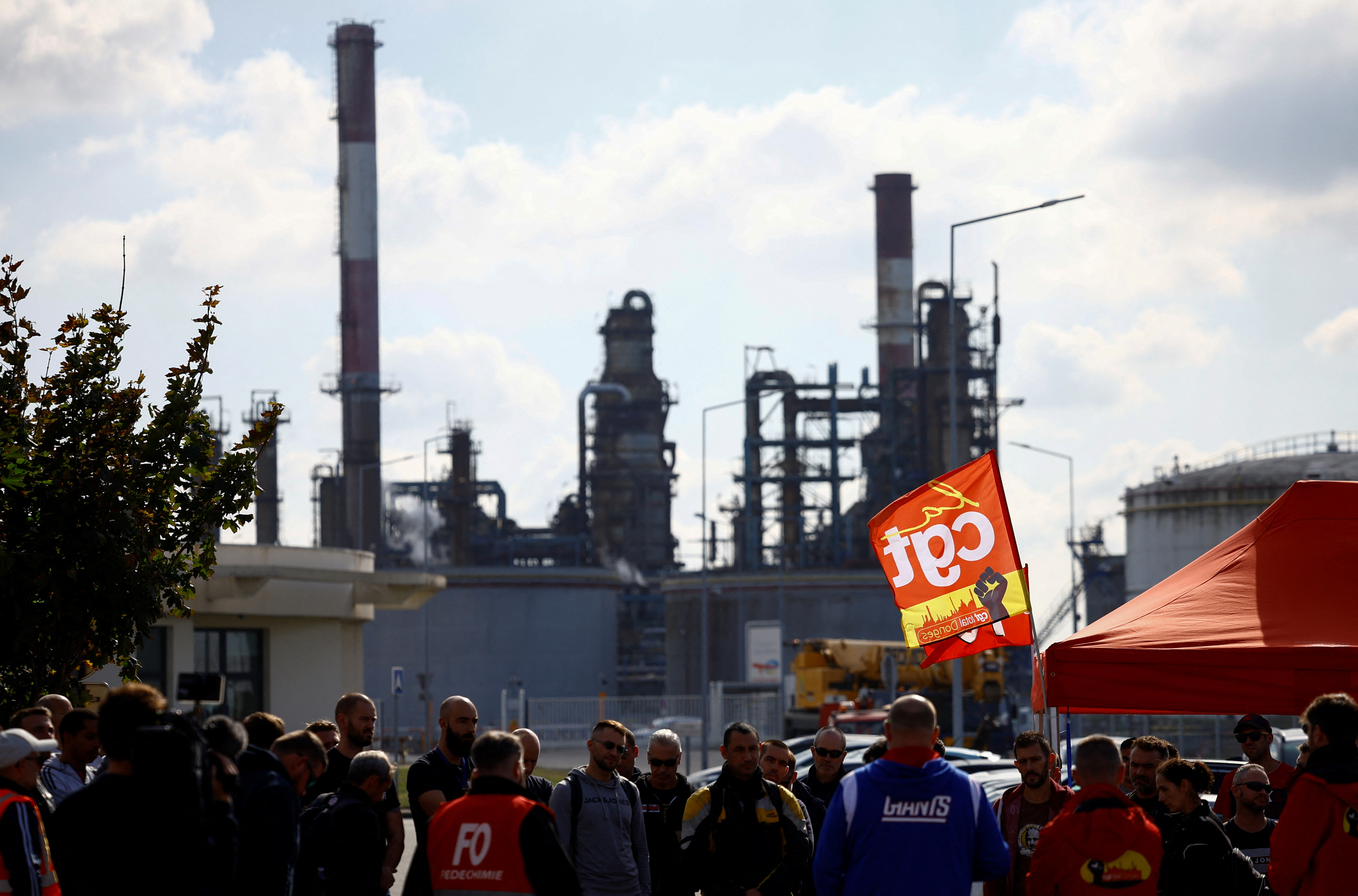 Workers on strike gather in front of the French oil giant TotalEnergies refinery in Donges