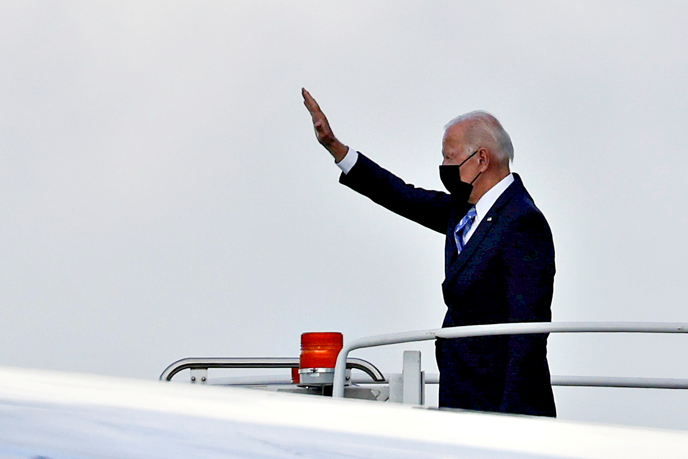 U.S. President Joe Biden waves as he boards Air Force One to depart O'Hare International Airport in Chicago, Illinois, U.S., October 7, 2021. REUTERS/Evelyn Hockstein