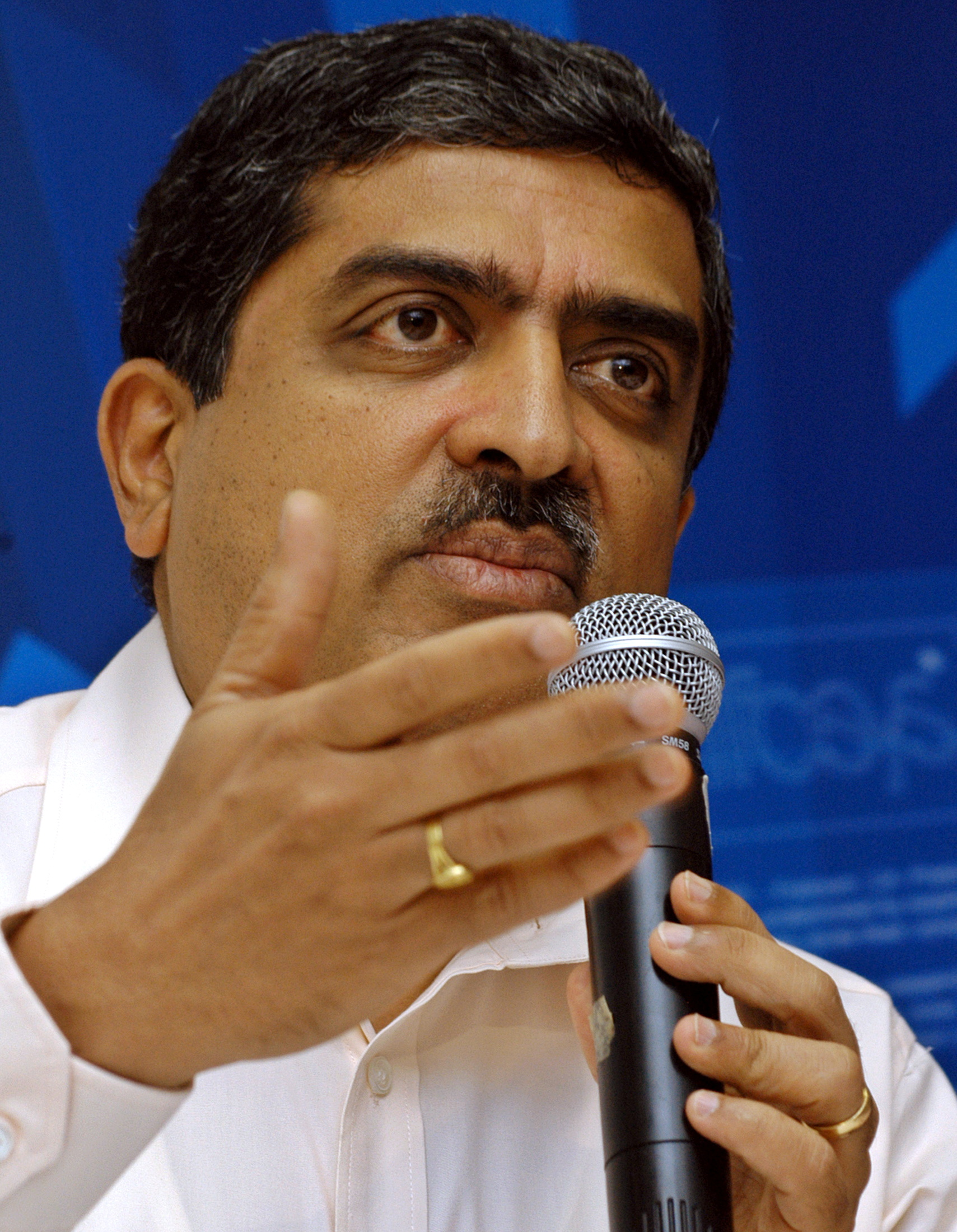 Nandan M. Nilekani, President, Chief Executive Officer and Managing Director of Infosys Technologies, speaks during a news conference in the southern Indian city of Bangalore July 12, 2006. REUTERS/Jagadeesh Nv/File Photo