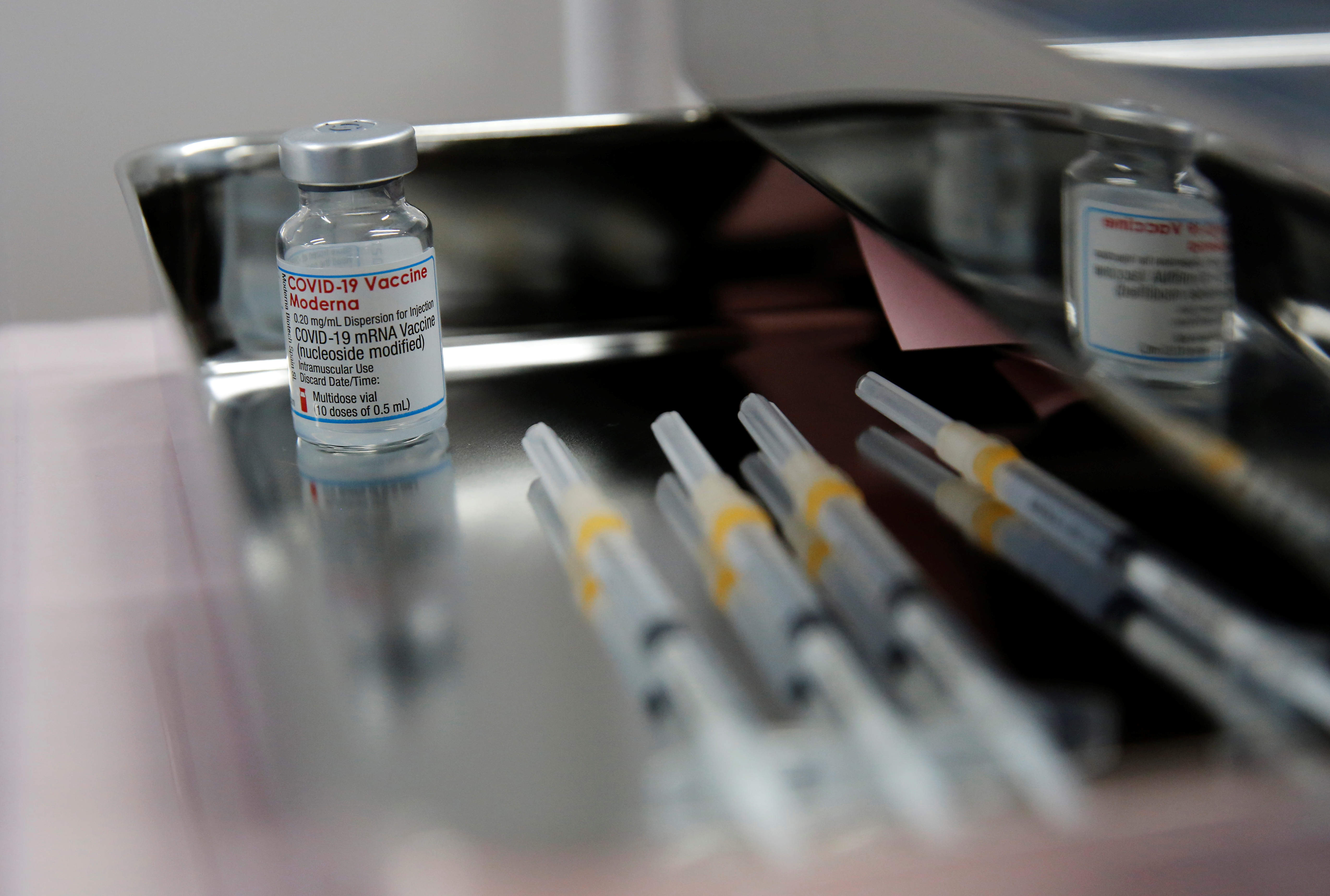 A vial containing doses of the Moderna vaccine against the coronavirus disease (COVID-19) and syringes are pictured at Japan Airlines (JAL) facility where its staff receive the vaccines at Haneda airport in Tokyo