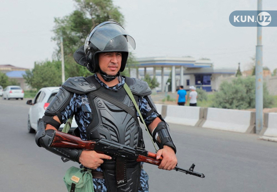 An Uzbek law enforcement officer guards a street in Nukus, capital of the northwestern Karakalpakstan region