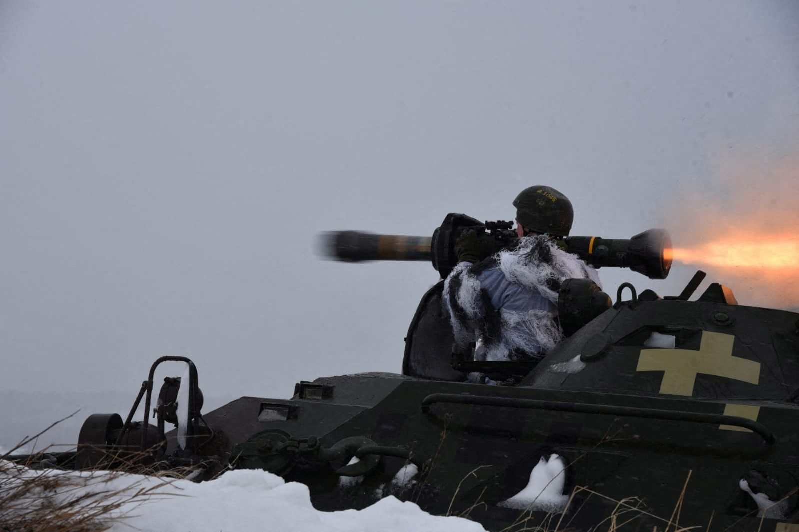 Ukrainian service members use NLAW missiles during drills in the Lviv region